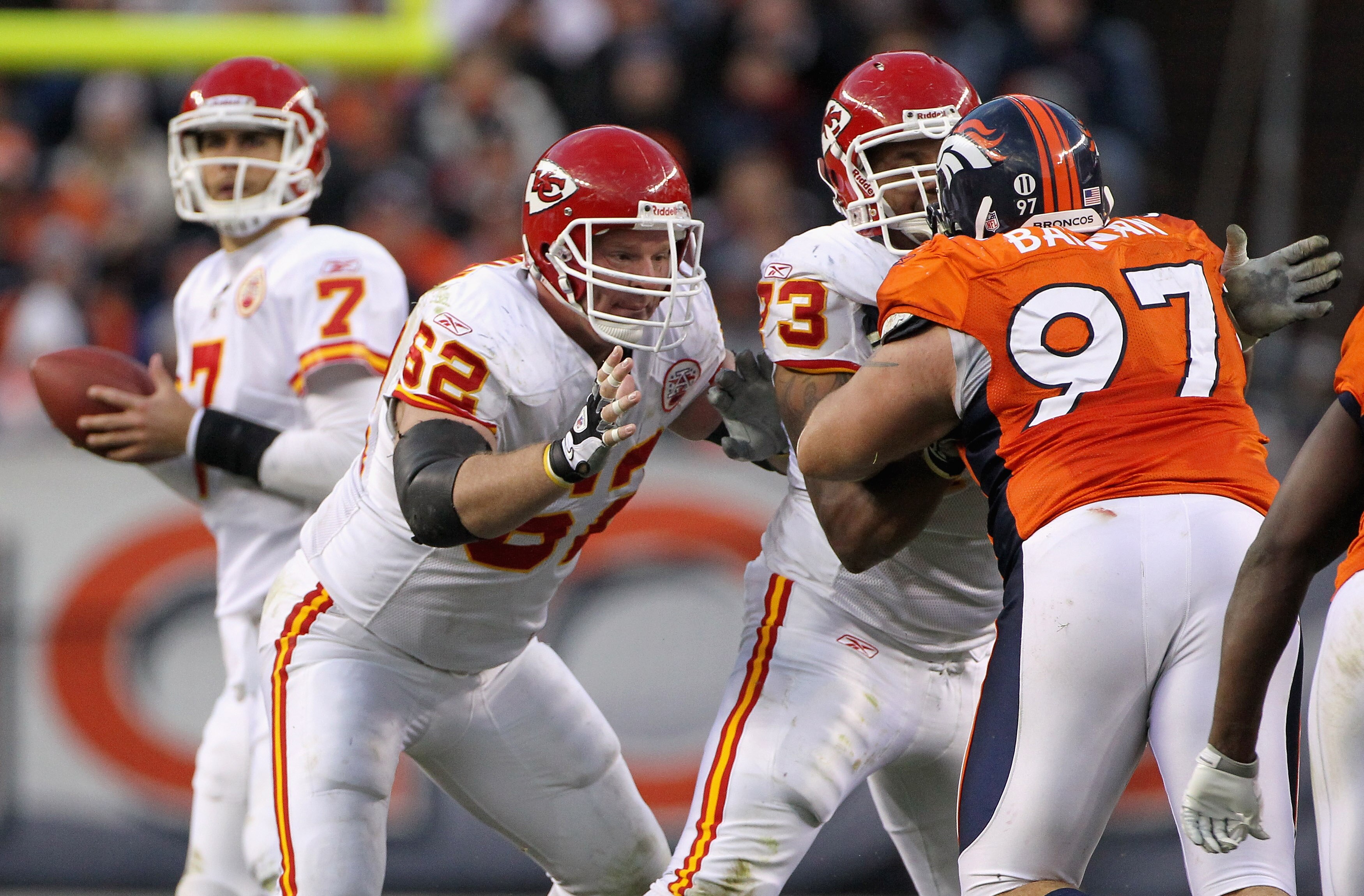 DENVER - NOVEMBER 14:  Center Casey Wiegman #62 and Jon Asamoah #73 of the Kansas City Chiefs team up to block Justin Bannan #97 of the Denver Bronco to protect quarterback Matt Cassel #7 at INVESCO Field at Mile High on November 14, 2010 in Denver, Color