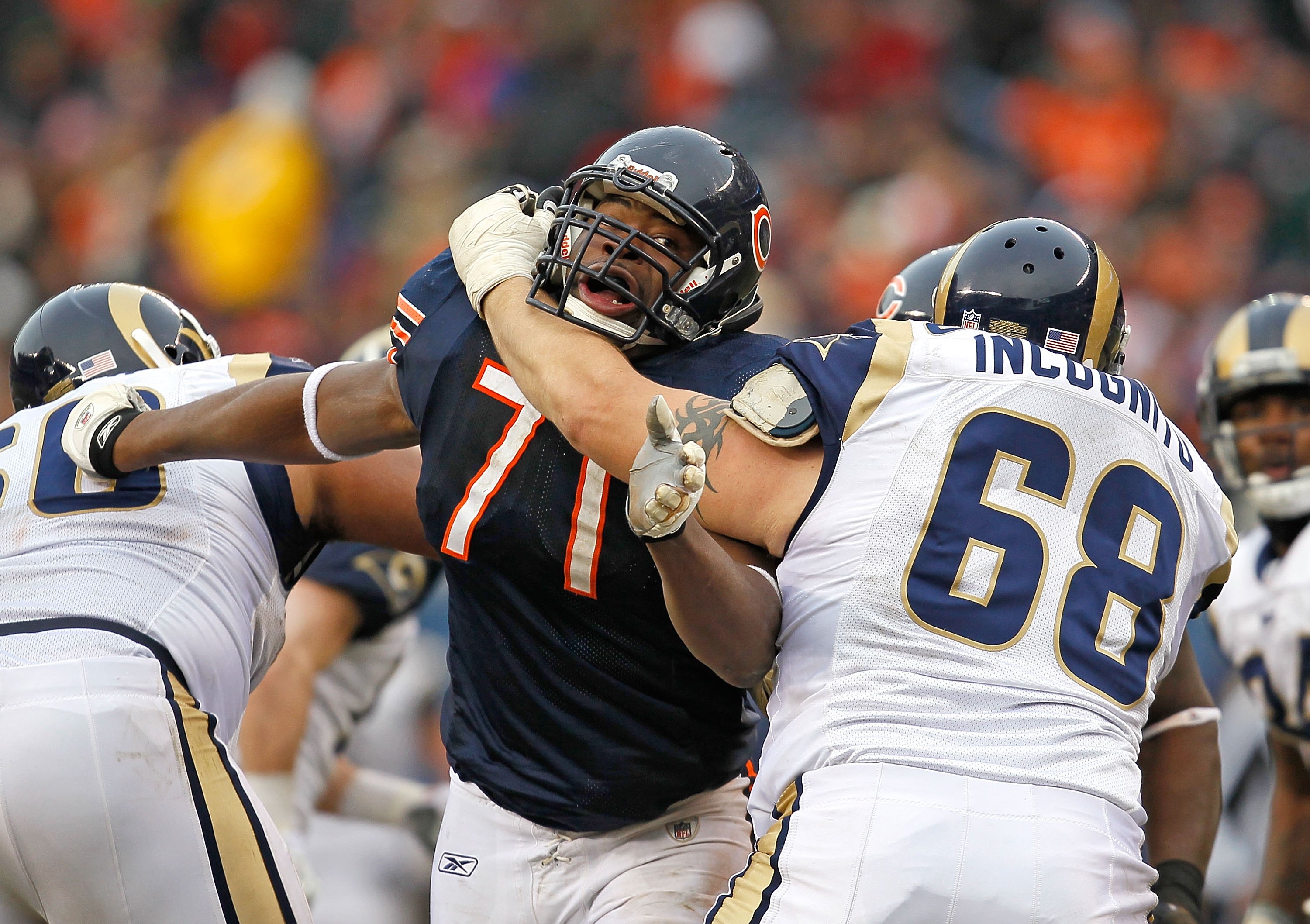 CHICAGO - DECEMBER 06: Israel Idonije #71 of the Chicago Bears rushes against Richie Incognito #68 of the St. Louis Rams at Soldier Field on December 6, 2009 in Chicago, Illinois. The Bears defeated the Rams 17-9. (Photo by Jonathan Daniel/Getty Images)