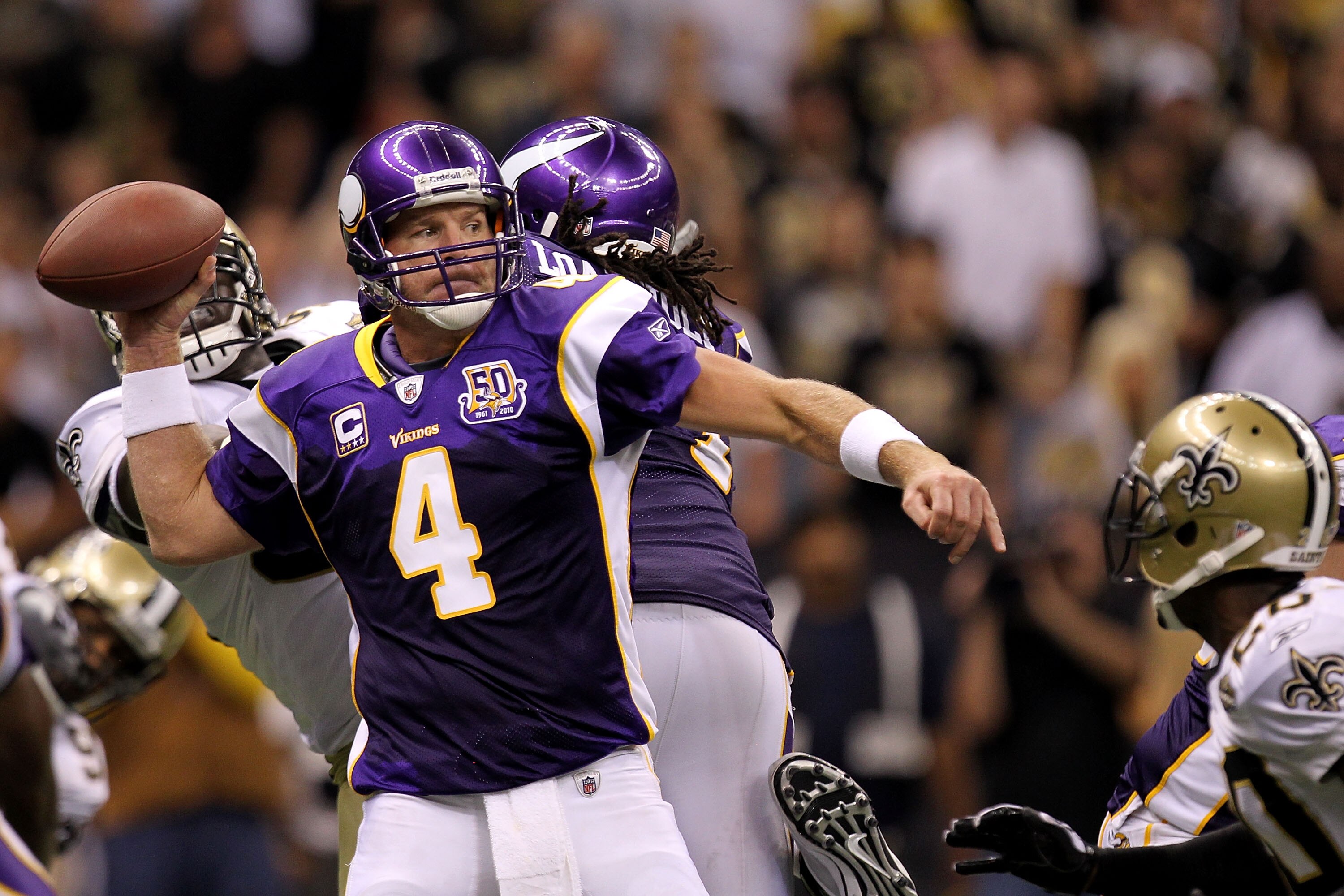 NEW ORLEANS - SEPTEMBER 09:  Quarterback Brett Favre #4 of the Minnesota Vikings throws a pass in the fourth quarter against the New Orleans Saints at Louisiana Superdome on September 9, 2010 in New Orleans, Louisiana. The Saints won 14-9.  (Photo by Rona