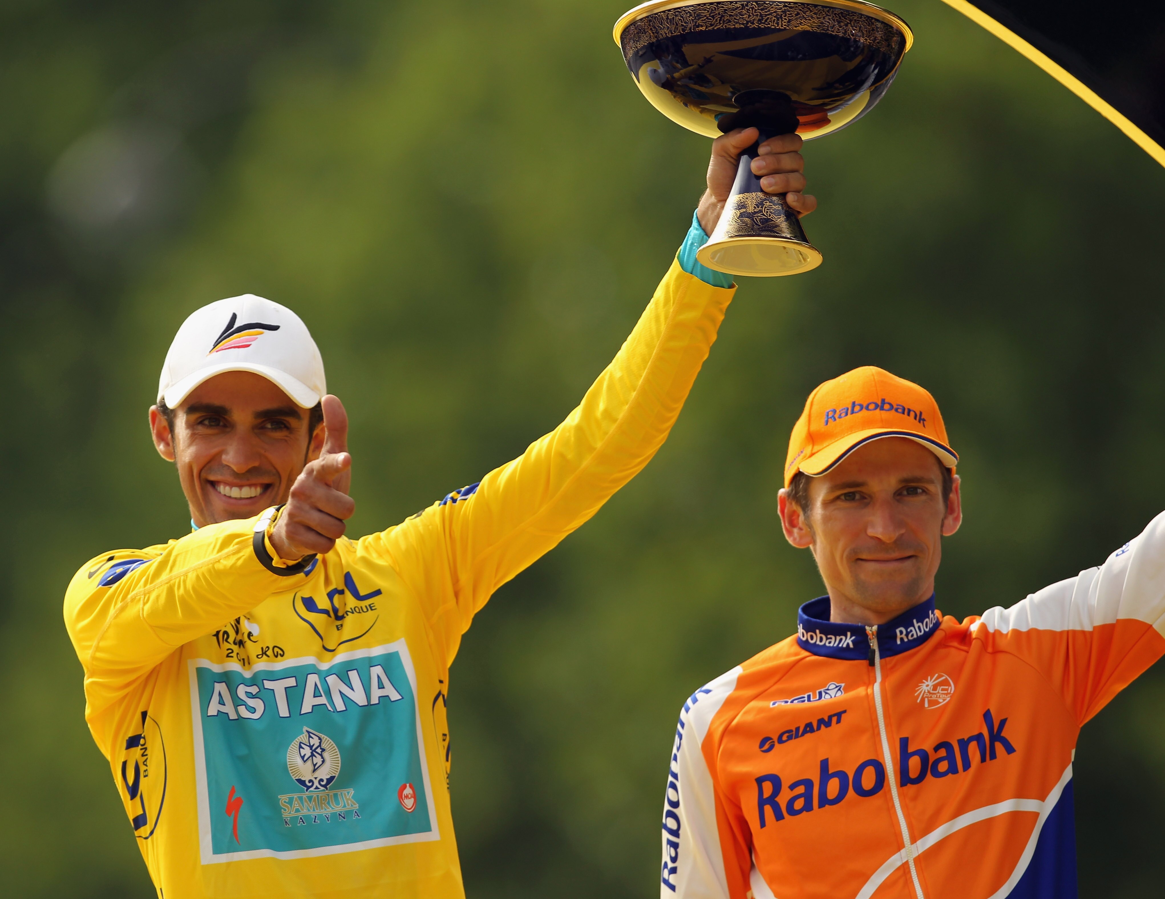 PARIS - JULY 25:  Alberto Contador of team Astana (L) celebrates as Denis Menchov of team Rabobank looks on after the twentieth and final stage of Le Tour de France 2010, from Longjumeau to the Champs-Elysees in Paris on July 25, 2010 in Paris, France.  (