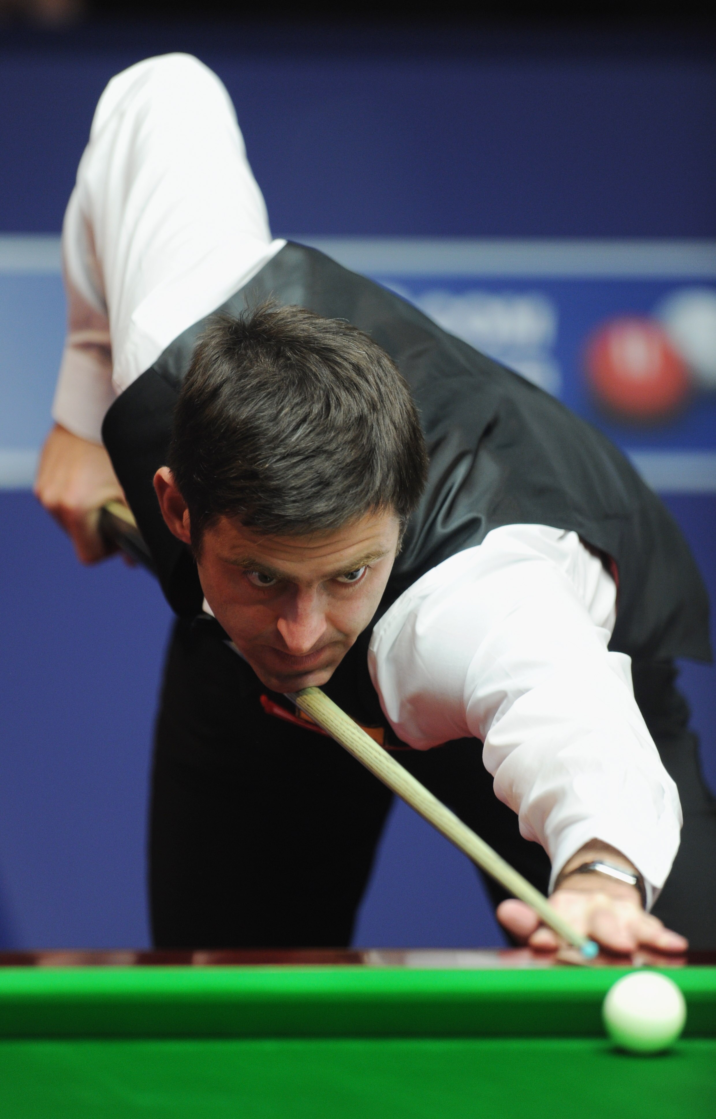 SHEFFIELD, ENGLAND - APRIL 27:  Ronnie O'Sullivan of England plays a shot in his quater-final match against John Higgins of Scotland during day twelve of the Betfred.com World Snooker Championship at the Crucible on April 27, 2011 in Sheffield, England.