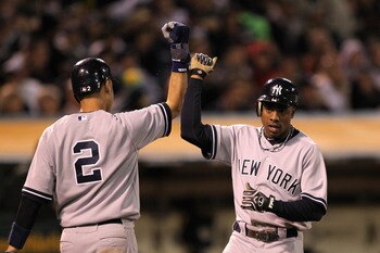 OAKLAND, CA - MAY 31:  Derek Jeter #2 and Curtis Granderson #14 of the New York Yankees congratulate one another after they scored on a single by Alex Rodriguez #13 of the New York Yankees in the sixth inning against the the Oakland Athletics at Oakland-A