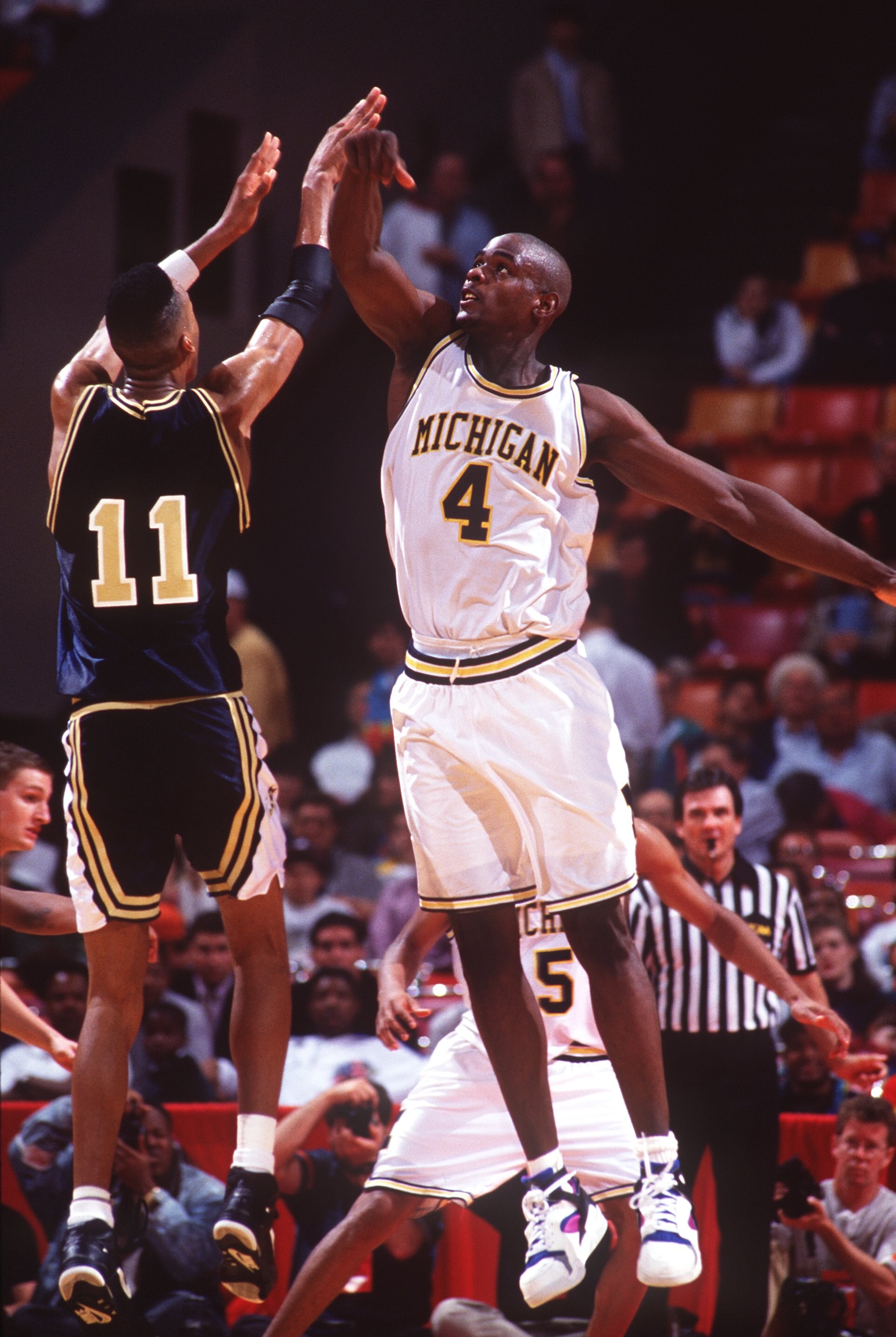 1992:  MICHIGAN FORWARD CHRIS WEBBER ATTEMPTS TO BLOCK THE SHOT OF A GEORGIA TECH PLAYER IN AN NCAA BASKETBALL GAME. Mandatory Credit: Allsport/ALLSPORT