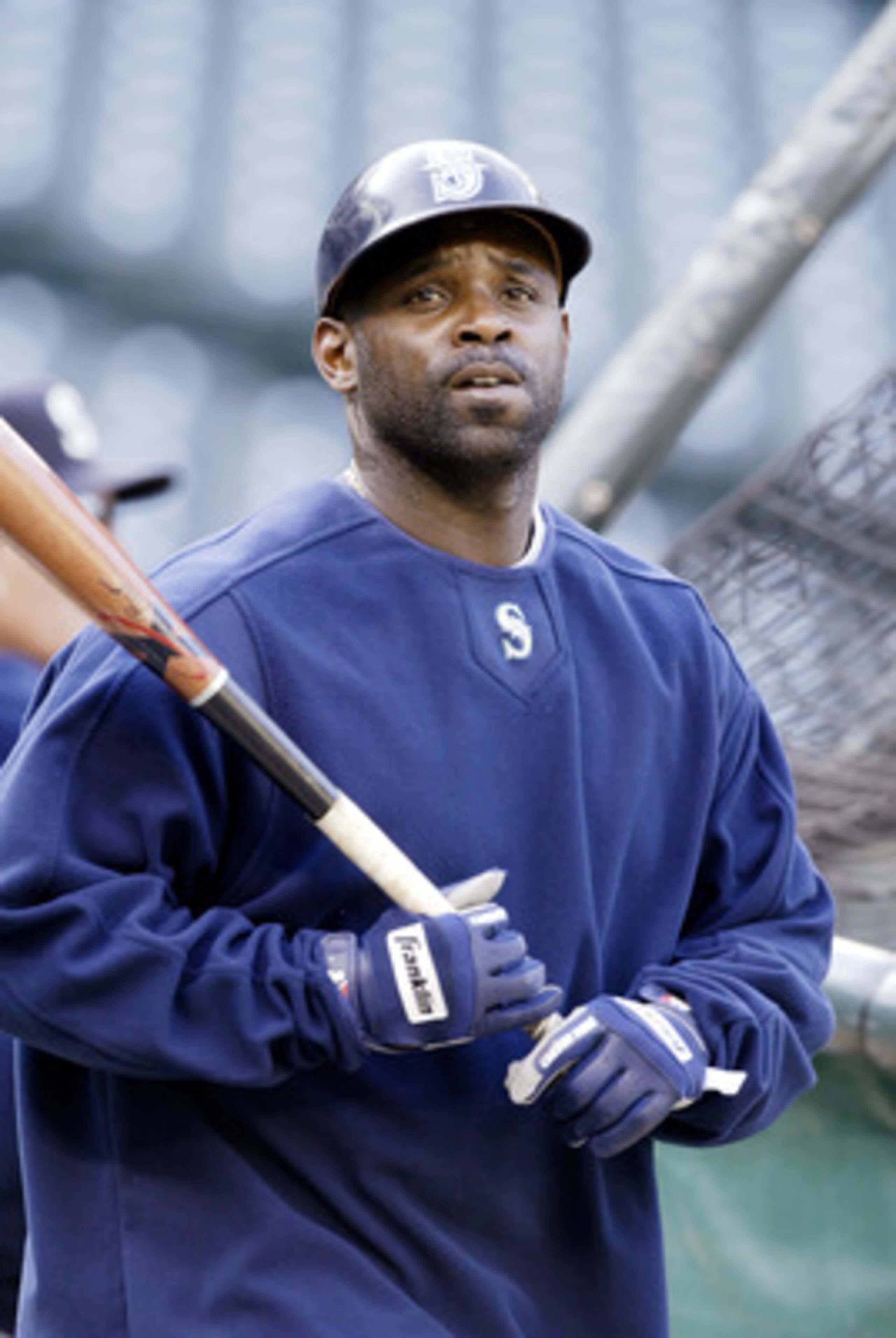 SEATTLE - APRIL 18:  Carl Everett #8 of the Seattle Mariners warms up before the game against the Texas Rangers on April 18, 2006 at Safeco Field in Seattle, Washington. The Rangers defeated the Mariners 7-4.  (Photo by Otto Greule Jr/Getty Images)