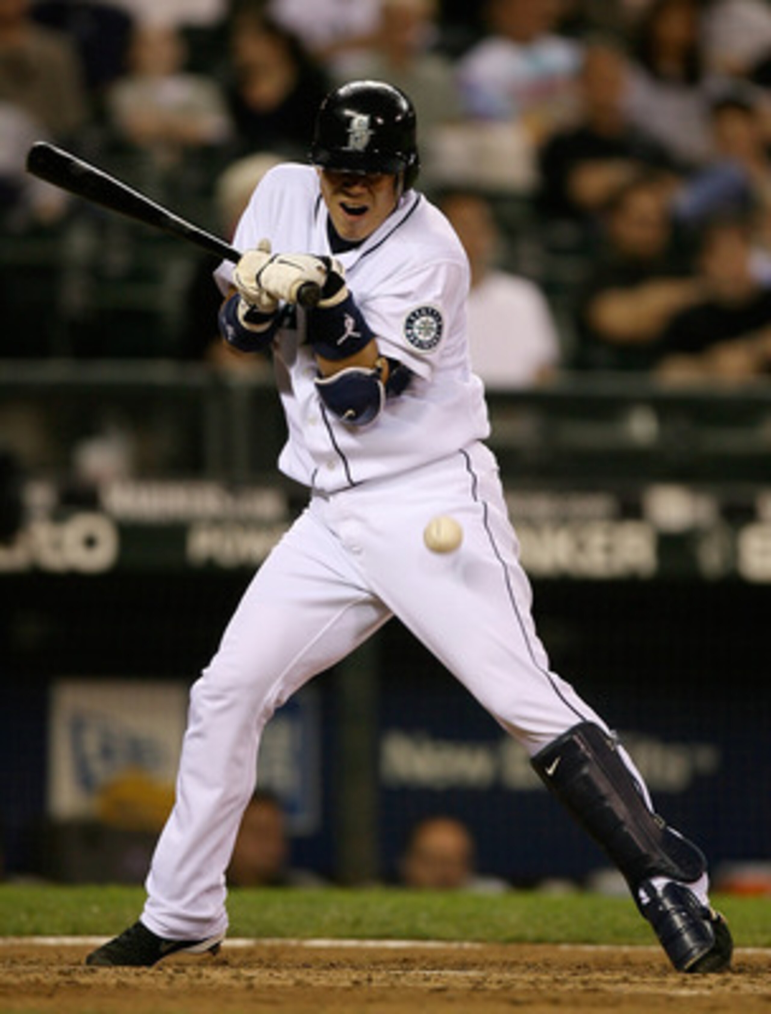 SEATTLE - SEPTEMBER 17:  Kenji Johjima #2 of the Seattle Mariners is hit by a pitch in the fourteenth inning against the Chicago White Sox on September 17, 2009 at Safeco Field in Seattle, Washington. The Mariners defeated the White Sox 4-3. (Photo by Ott