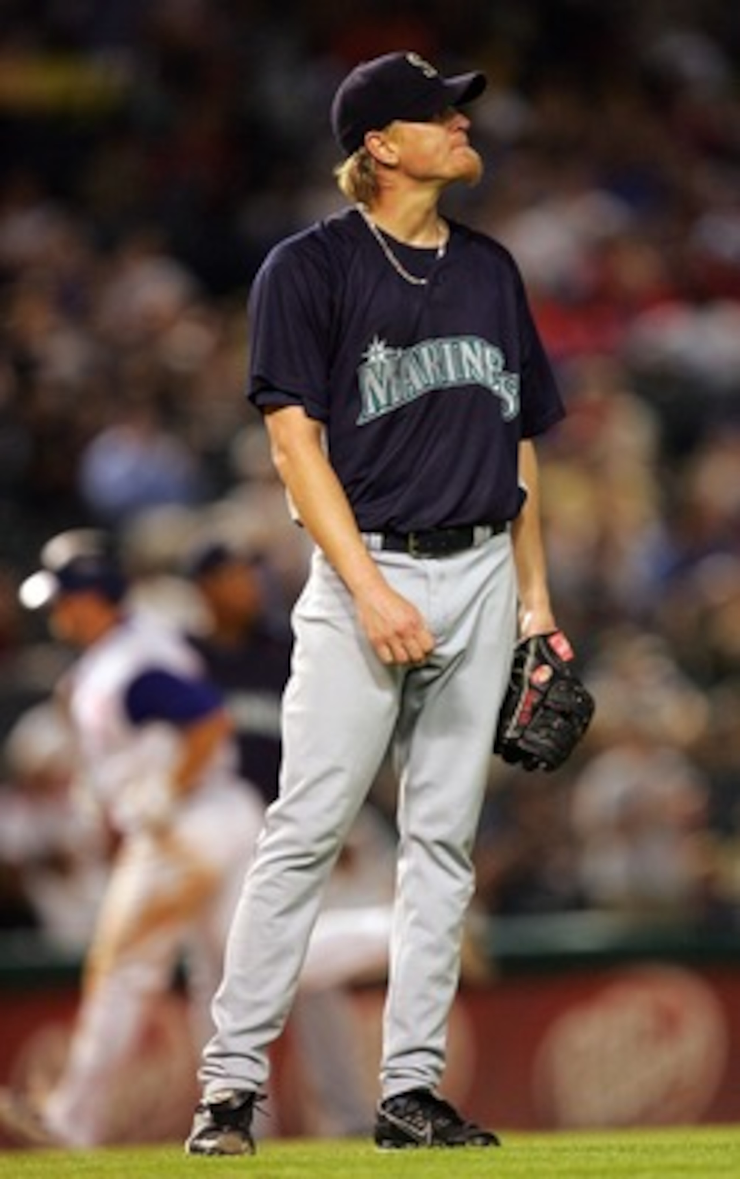 ARLINGTON, TX - AUGUST 23: Jeff Weaver #36 of the Seattle Mariners steps off the mound after Brad Wilkerson #6 of the Texas Rangers hit a two-run homerun on August 23, 2007 at Rangers Ballpark in Arlington, Texas.   (Photo by Ronald Martinez/Getty Images)