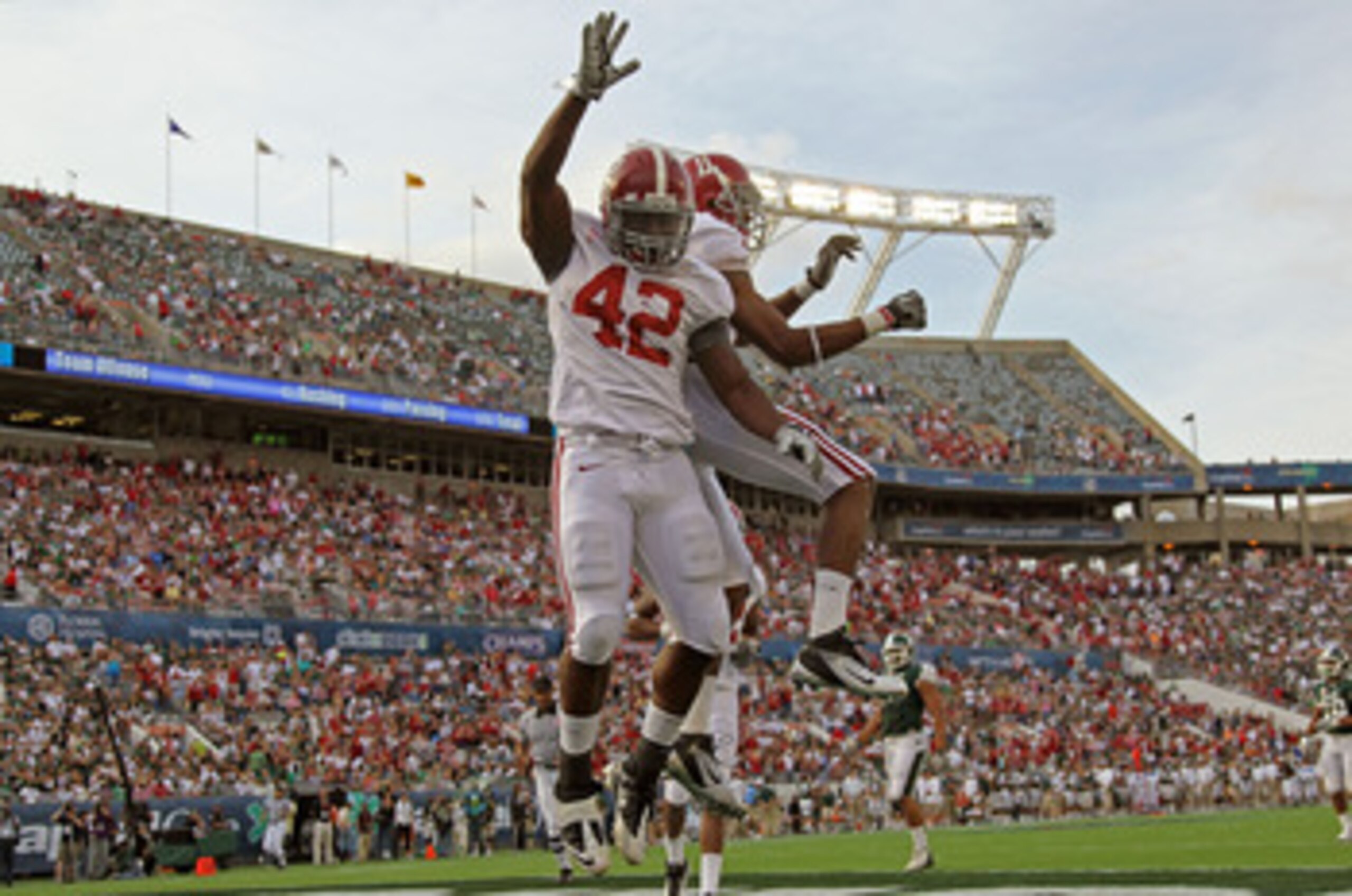 ORLANDO, FL - JANUARY 01:  Eddie Lacy #42 of the Alabama Crimson Tide celebrates after rushing for a touchdown during the Capitol One Bowl against the Michigan State Spartans at the Florida Citrus Bowl on January 1, 2011 in Orlando, Florida.  (Photo by Mi