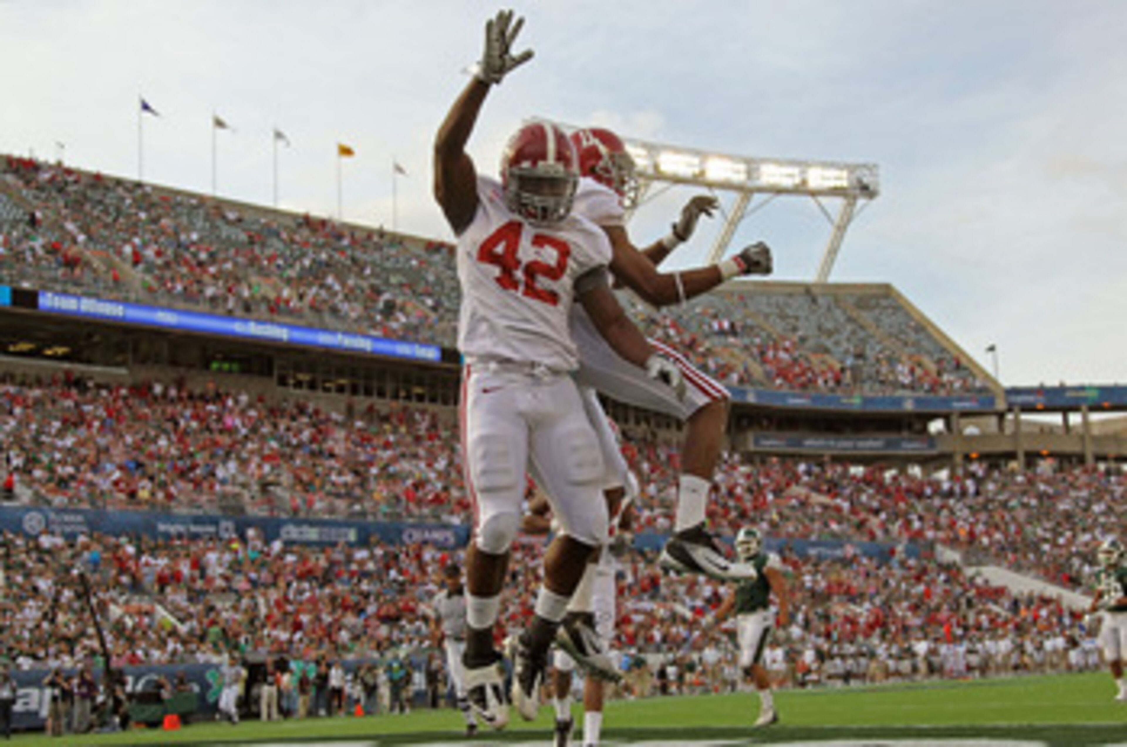 ORLANDO, FL - JANUARY 01: Eddie Lacy #42 of the Alabama Crimson Tide celebrates after rushing for a touchdown during the Capitol One Bowl against the Michigan State Spartans at the Florida Citrus Bowl on January 1, 2011 in Orlando, Florida. (Photo by Mi ORLANDO, FL - JANUARY 01: Eddie Lacy #42 of the Alabama Crimson Tide celebrates after rushing for a touchdown during the Capitol One Bowl against the Michigan State Spartans at the Florida Citrus Bowl on January 1, 2011 in Orlando, Florida. (Photo by Mi