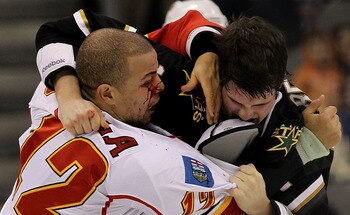 DALLAS, TX - DECEMBER 23:  Right wing Jarome Iginla #12 of the Calgary Flames fights with Jamie Benn #14 of the Dallas Stars at American Airlines Center on December 23, 2010 in Dallas, Texas.  (Photo by Ronald Martinez/Getty Images)