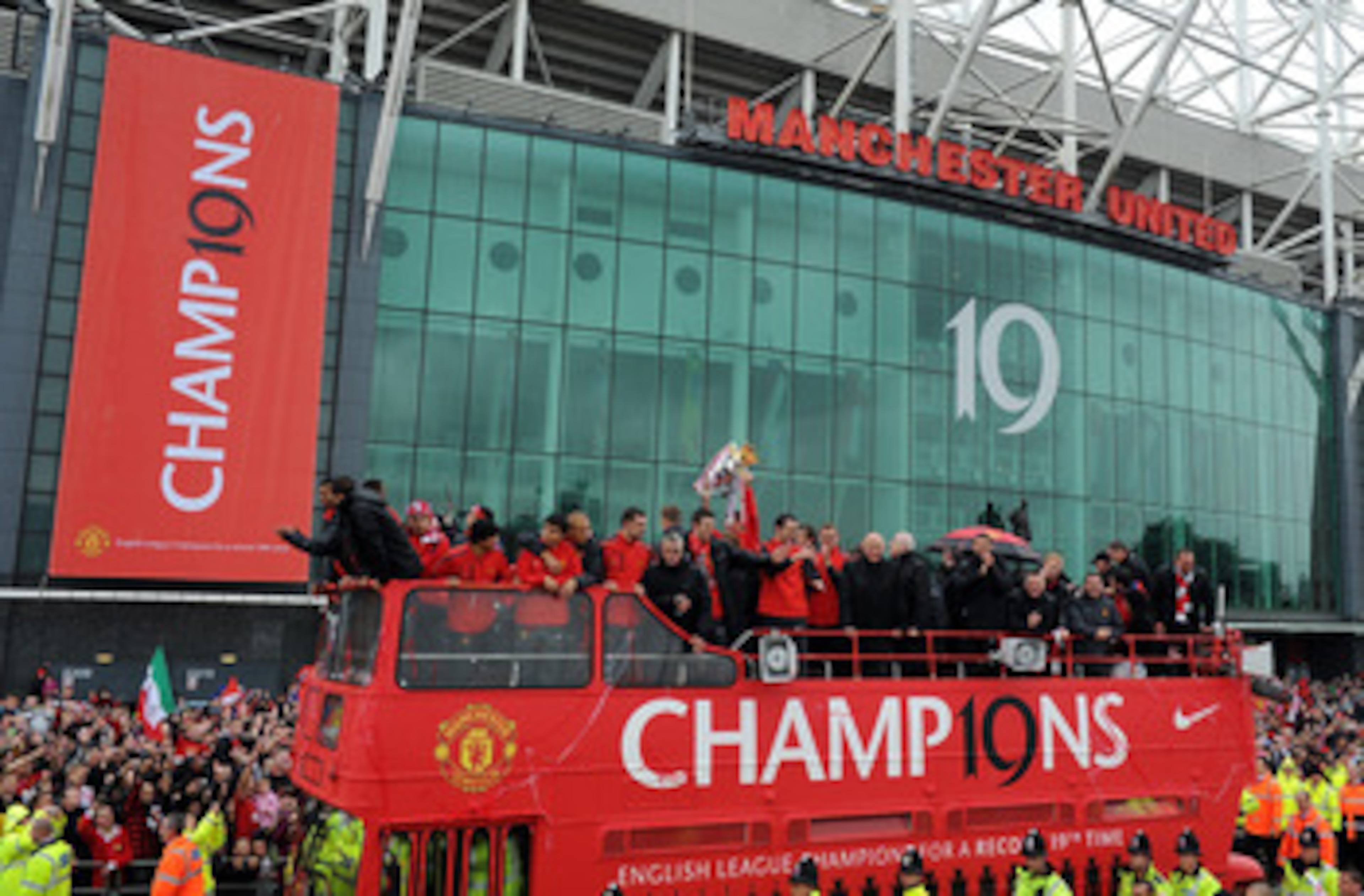 MANCHESTER, ENGLAND - MAY 30:  The Manchester United open top bus travels past Old Trafford during the Manchester United Premier League Winners Parade at Old Trafford on May 30, 2011 in Manchester, United Kingdom.  (Photo by Chris Brunskill/Getty Images)
