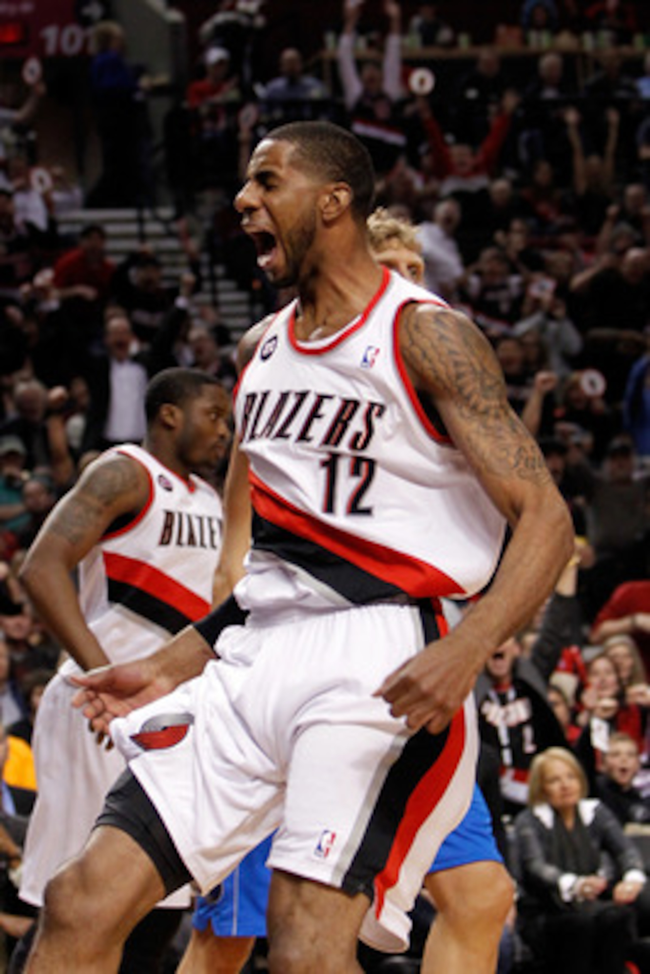 PORTLAND, OR - APRIL 21:  LaMarcus Aldridge #12 of the Portland Trail Blazers celebrates a dunk against the Dallas Mavericks in Game Three of the Western Conference Quarterfinals in the 2011 NBA Playoffs on April 21, 2011 at the Rose Garden in Portland, O