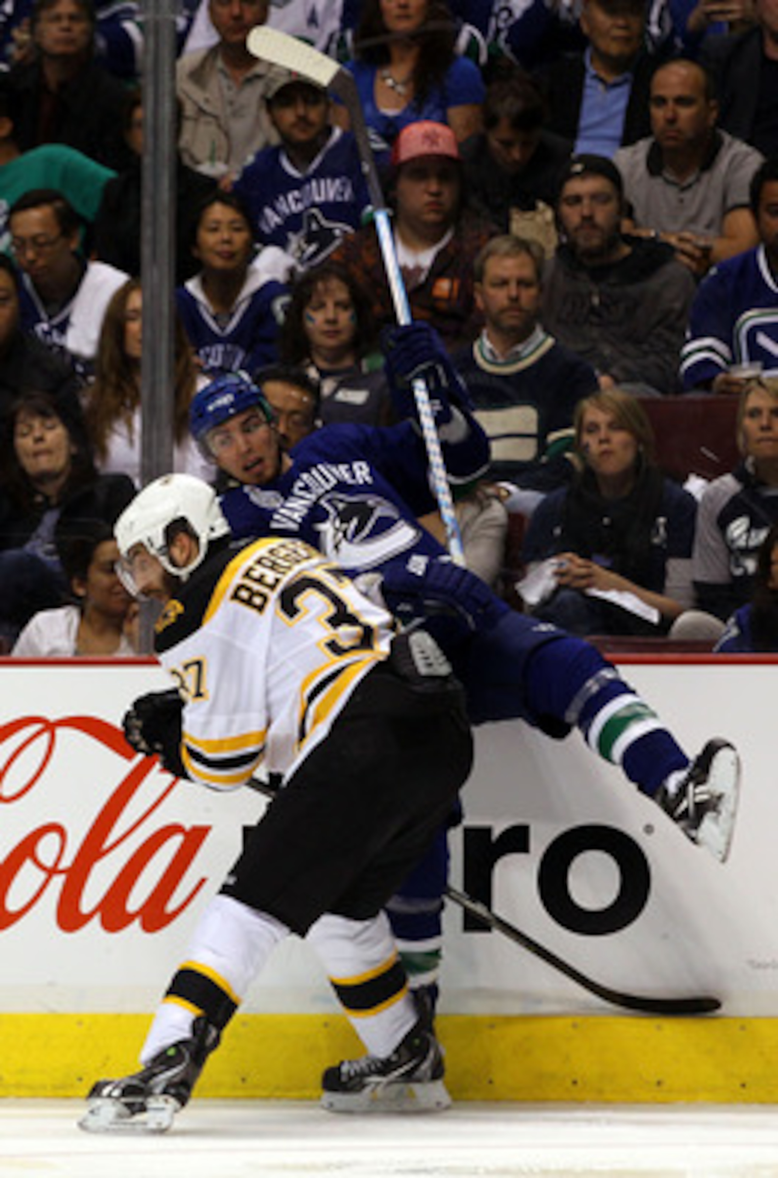VANCOUVER, BC - JUNE 01:  Patrice Bergeron #37 of the Boston Bruins checks Alex Burrows #14 of the Vancouver Canucks during game one of the 2011 NHL Stanley Cup Finals at Rogers Arena on June 1, 2011 in Vancouver, Canada.  (Photo by Bruce Bennett/Getty Im