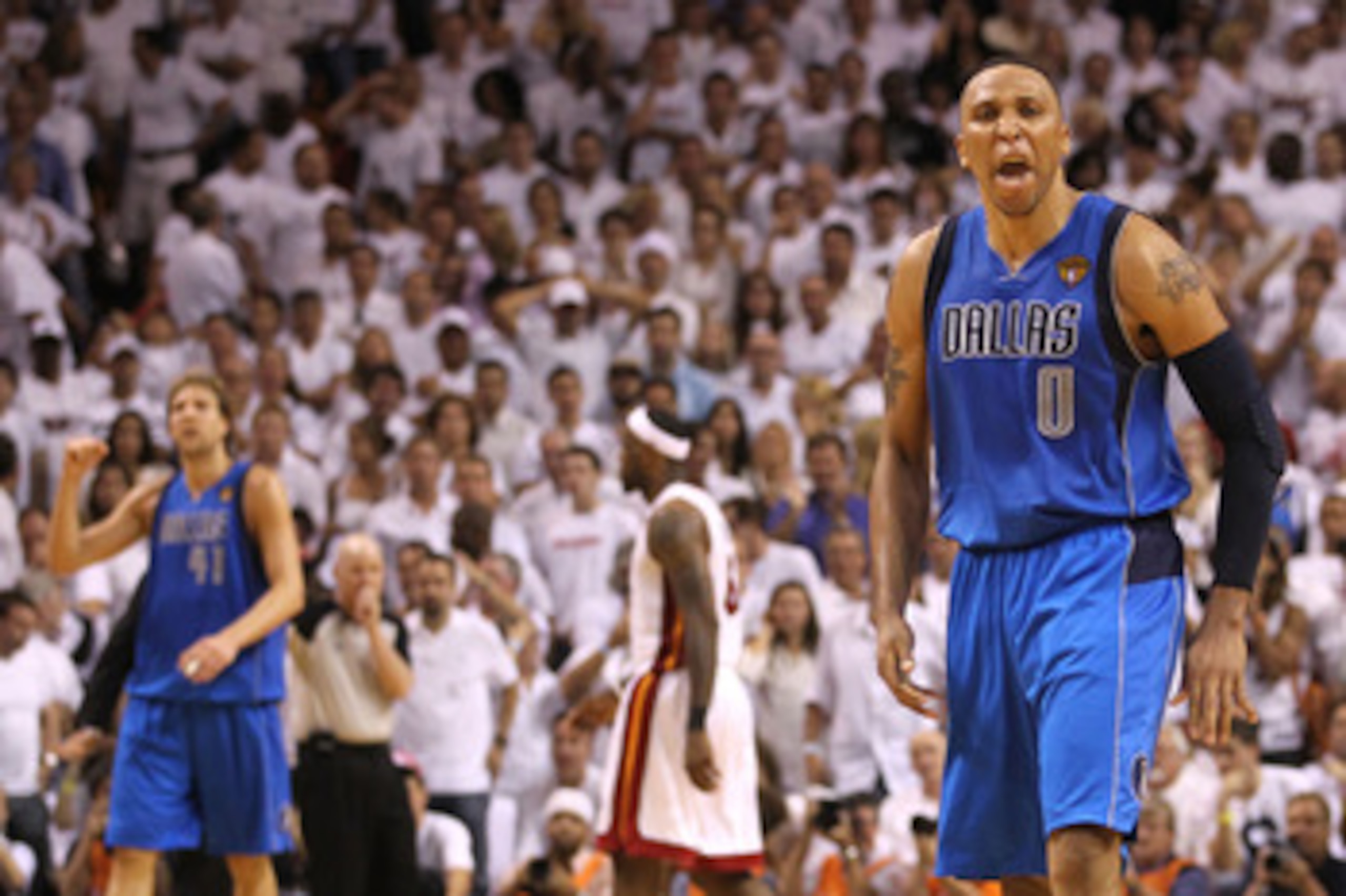 MIAMI, FL - JUNE 02:  Shawn Marion #0 (R) and Dirk Nowitzki #41 (L) of the Dallas Mavericks celebrate as LeBron James #6 of the Miami Heat walks towards the bench in Game Two of the 2011 NBA Finals at American Airlines Arena on June 2, 2011 in Miami, Flor