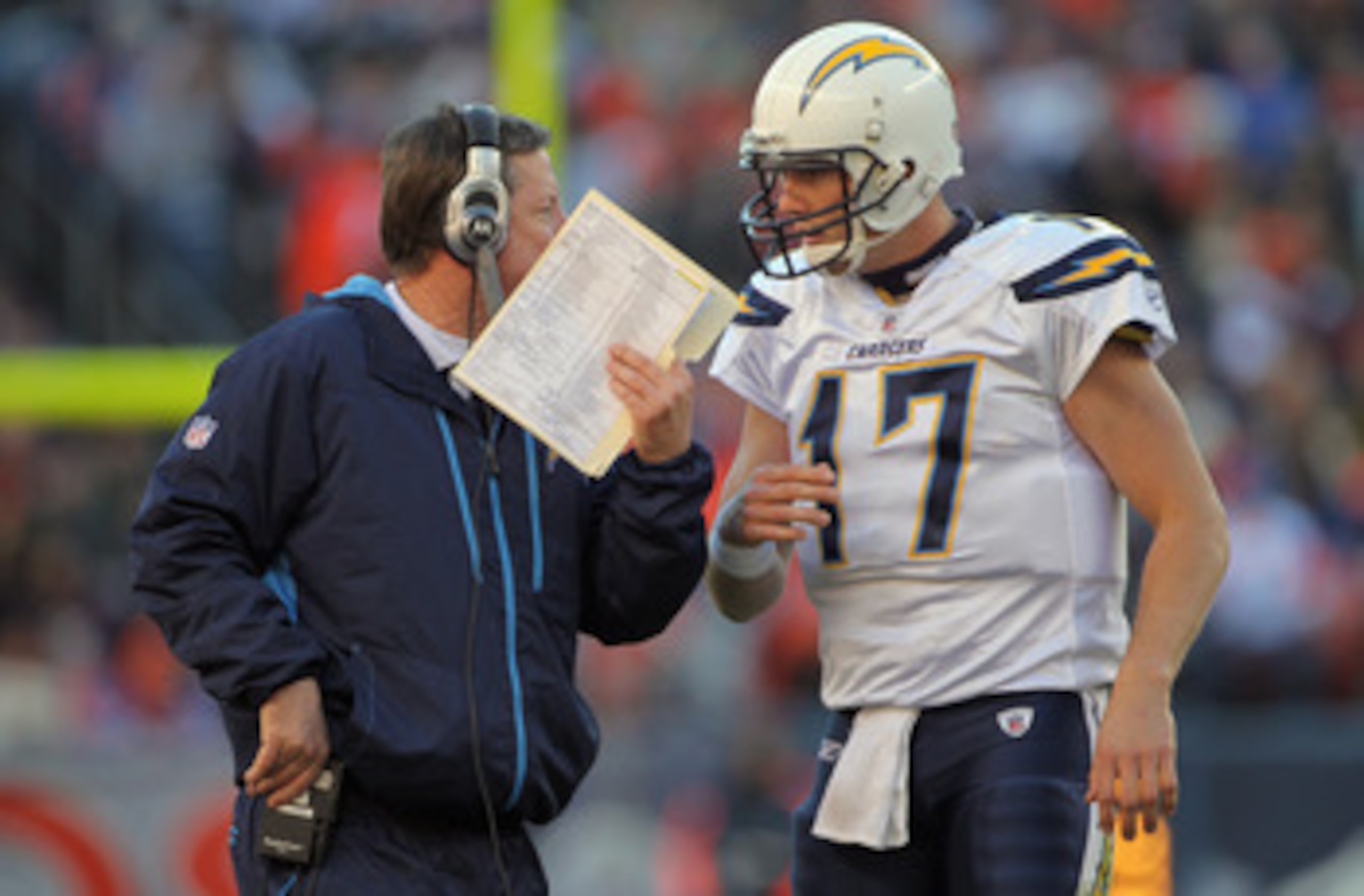 DENVER - JANUARY 02:  Head coach Norv Turner talks with quarterback Philip Rivers #17 of the San Diego Chargers as they face the Denver Broncos at INVESCO Field at Mile High on January 2, 2011 in Denver, Colorado. The Chargers defeated the Broncos 33-28. 