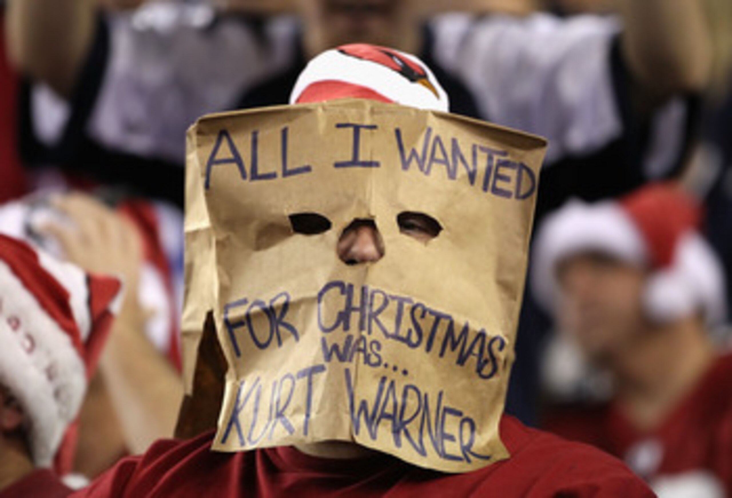 GLENDALE, AZ - DECEMBER 25:  A fan of the Arizona Cardinals wears a bag on his head during the NFL game against the Dallas Cowboys at the University of Phoenix Stadium on December 25, 2010 in Glendale, Arizona.  The Cardinals defeated the Cowboys 27-26.  