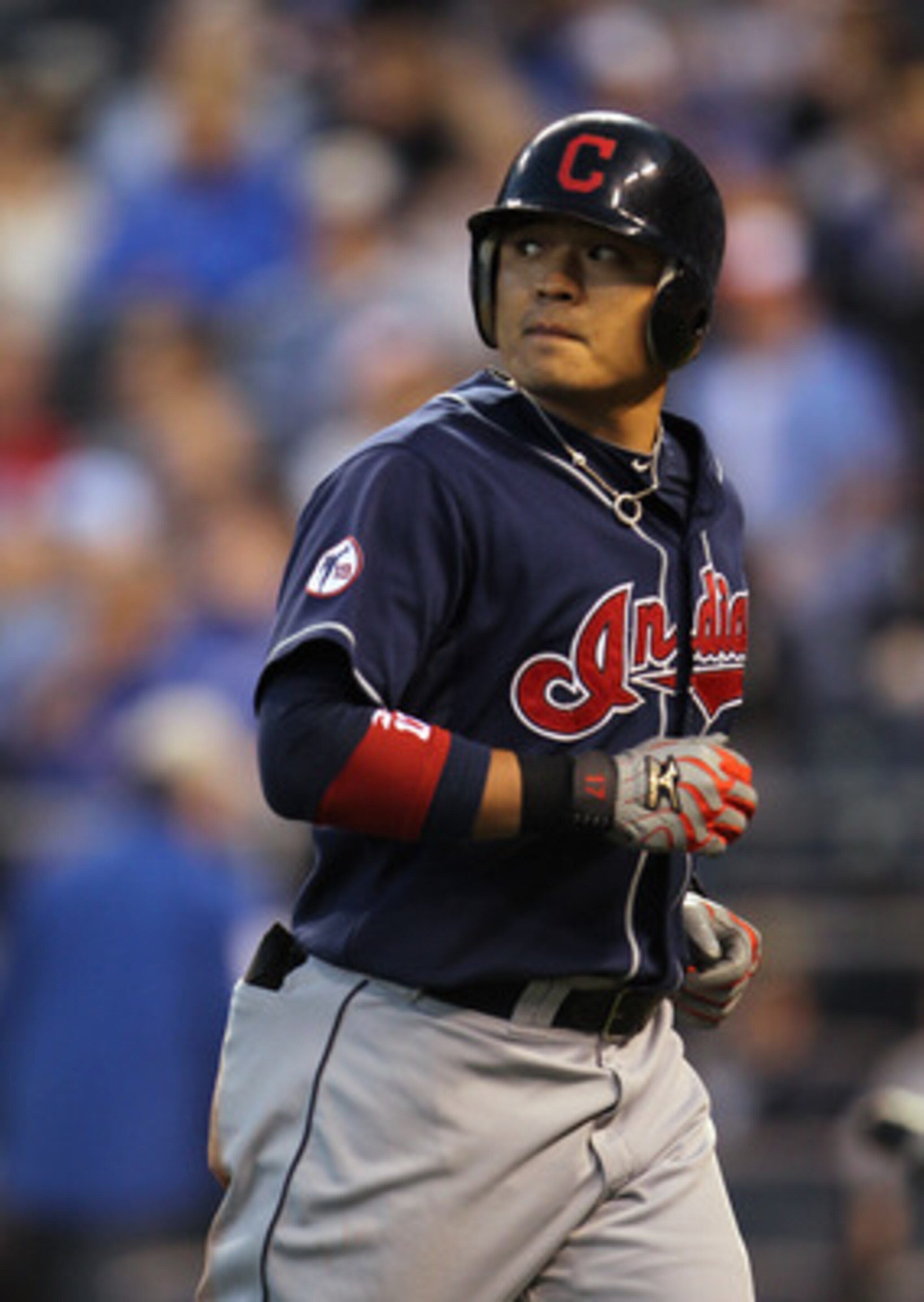 KANSAS CITY, MO - MAY 16:  Shin-Soo Choo #17 of the Cleveland Indians jogs back to the dugout after flying out during the 4th inning of the game against the Kansas City Royals on May 16, 2011 at Kauffman Stadium in Kansas City, Missouri.  (Photo by Jamie