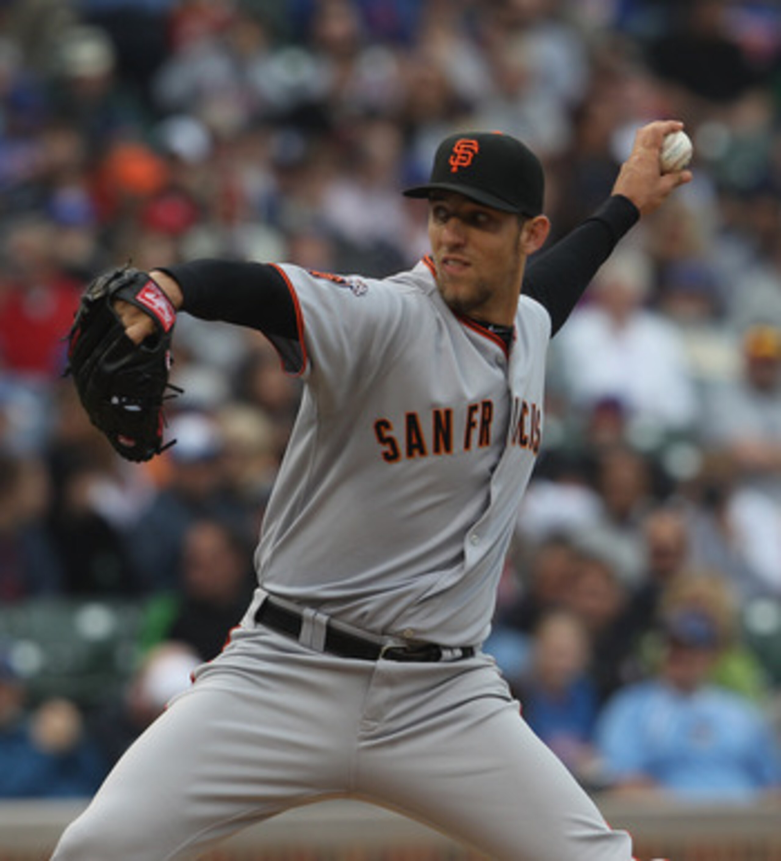 CHICAGO, IL - MAY 13:  Starting pitcher Madison Bumgarner #40 of the San Francisco Giants delivers the ball against the Chicago Cubs at Wrigley Field on May 13, 2011 in Chicago, Illinois. The Cubs defeated the Giants 11-4.  (Photo by Jonathan Daniel/Getty