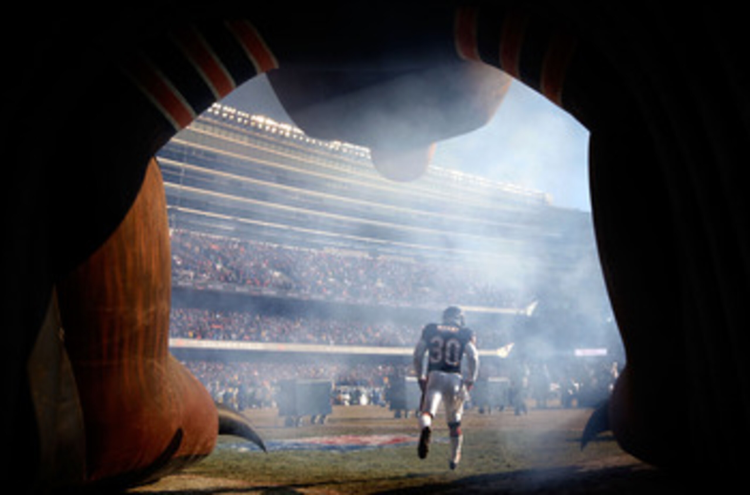 CHICAGO, IL - JANUARY 23:  D.J. Moore #30 of the Chicago Bears runs out of the tunnel to take on the Green Bay Packers during the NFC Championship Game at Soldier Field on January 23, 2011 in Chicago, Illinois.  (Photo by Jamie Squire/Getty Images)