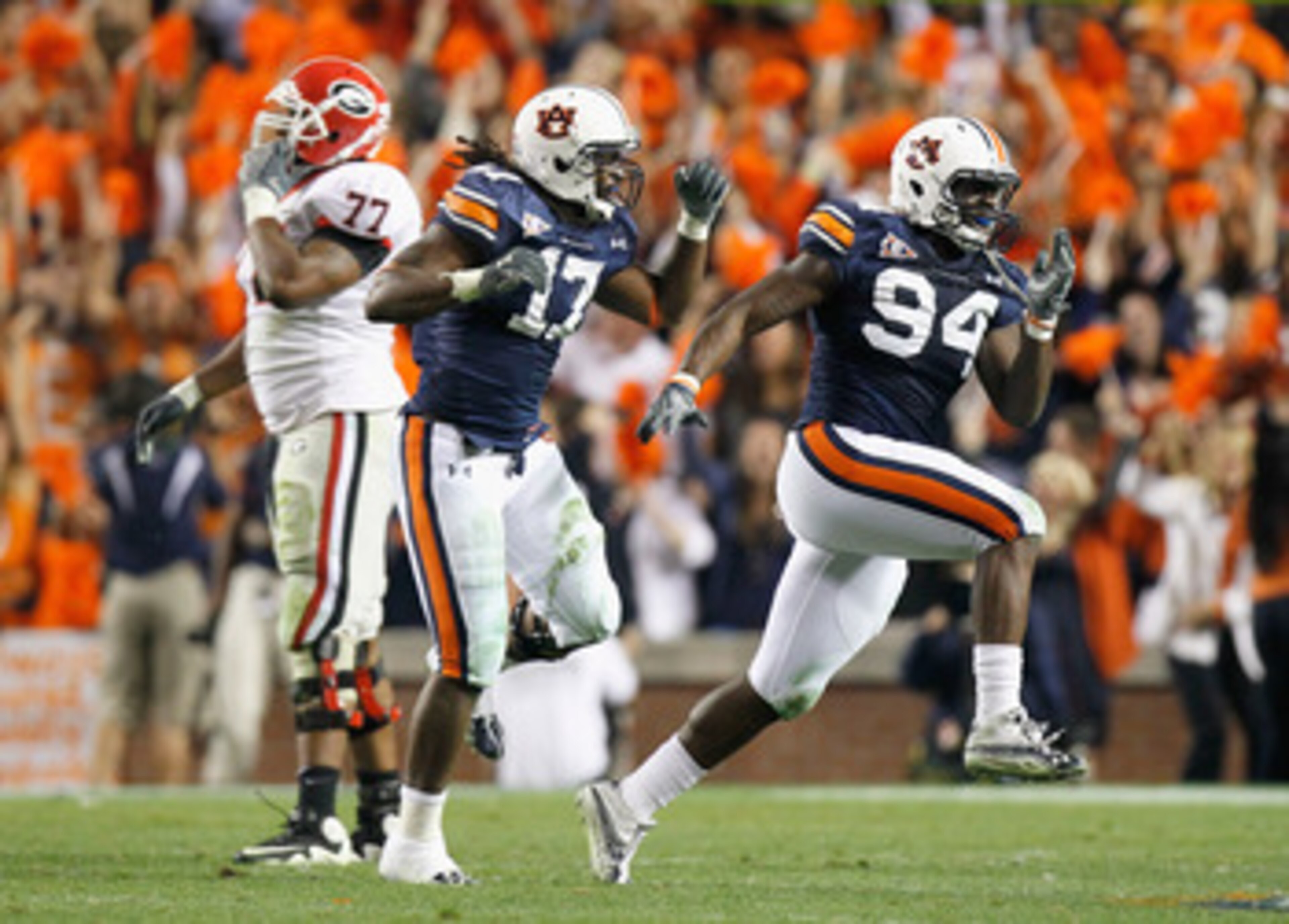 AUBURN, AL - NOVEMBER 13:  Nosa Eguae #94 and Josh Bynes #17 of the Auburn Tigers react after a defensive stop of fourth down for the Georgia Bulldogs at Jordan-Hare Stadium on November 13, 2010 in Auburn, Alabama.  (Photo by Kevin C. Cox/Getty Images)