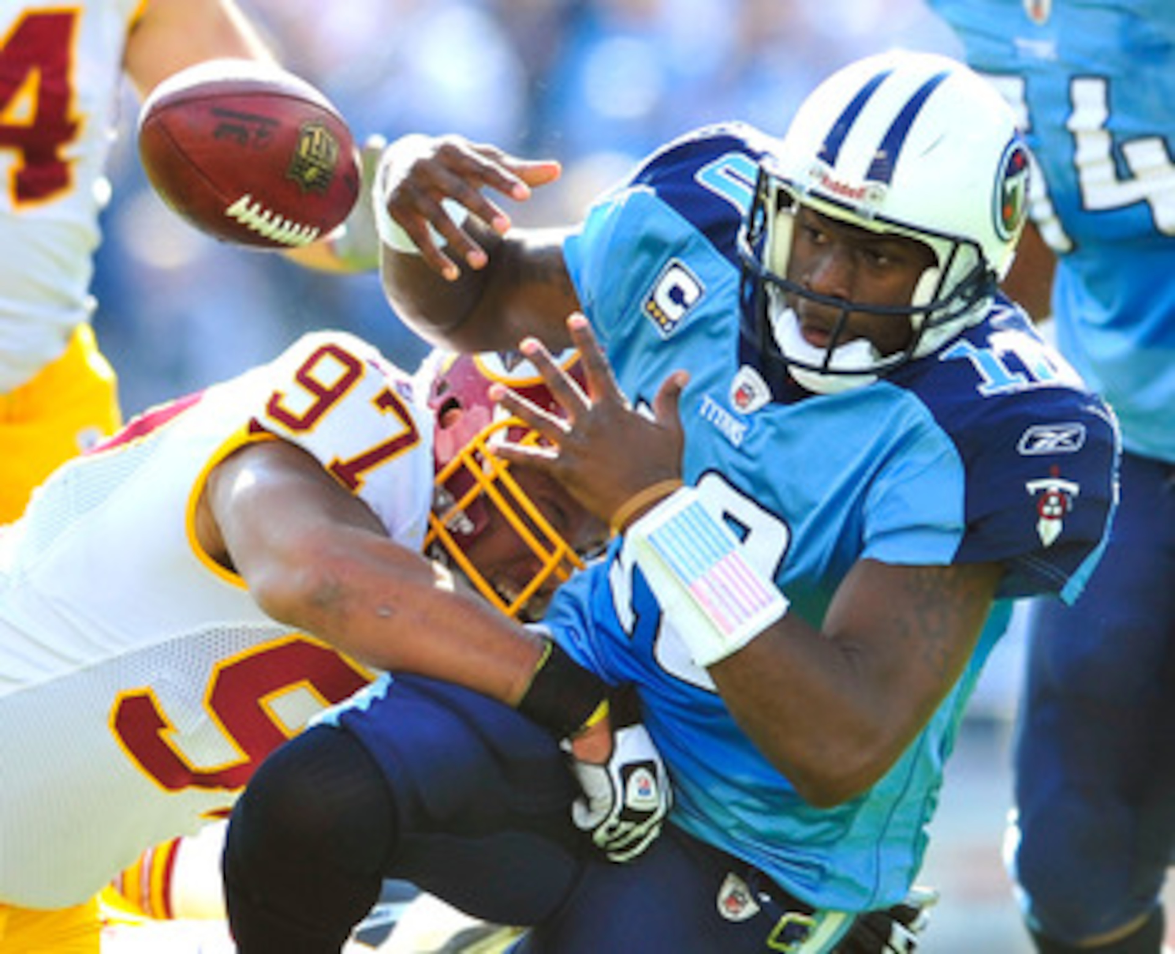 NASHVILLE, TN - NOVEMBER 21:  Lorenzo Alexander #97 of the Washington Redskins forces a fumble by quarterback Vince Young #10 of the Tennessee Titans during the first half at LP Field on November 21, 2010 in Nashville, Tennessee.  (Photo by Grant Halverso