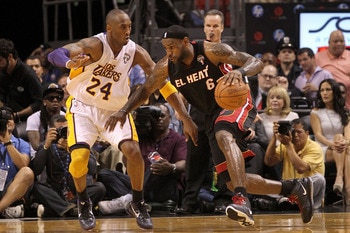 MIAMI, FL - MARCH 10:  LeBron James #6 of the Miami Heat posts up Kobe Bryant #24 of  the Los Angeles Lakers  during a game at American Airlines Arena on March 10, 2011 in Miami, Florida. NOTE TO USER: User expressly acknowledges and agrees that, by downl
