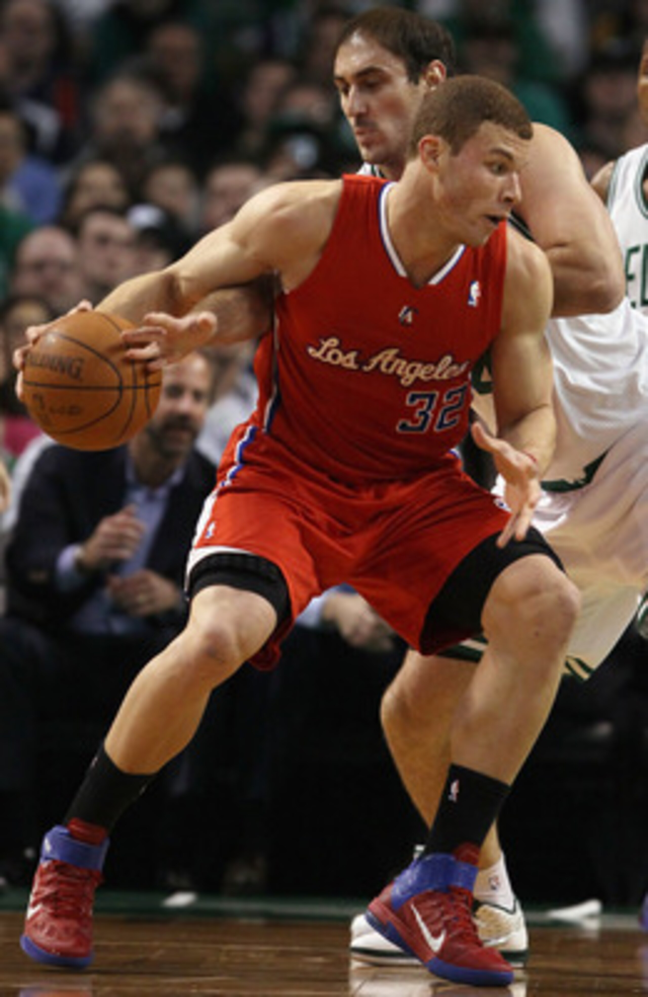 BOSTON, MA - MARCH 09:  Blake Griffin #32 of the Los Angeles Clippers tries to keep the ball from Nenad Krstic #4 of the Boston Celtics on March 9, 2011 at the TD Garden in Boston, Massachusetts. NOTE TO USER: User expressly acknowledges and agrees that, 