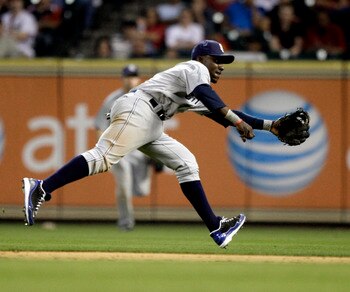 HOUSTON - APRIL 15:  Second baseman Orlando Hudson #1 of the San Diego Padres can't reach this ground ball hit by Carlos Lee #45 of the Houston Astros in the ninth inning at Minute Maid Park on April 15, 2011 in Houston, Texas.  (Photo by Bob Levey/Getty