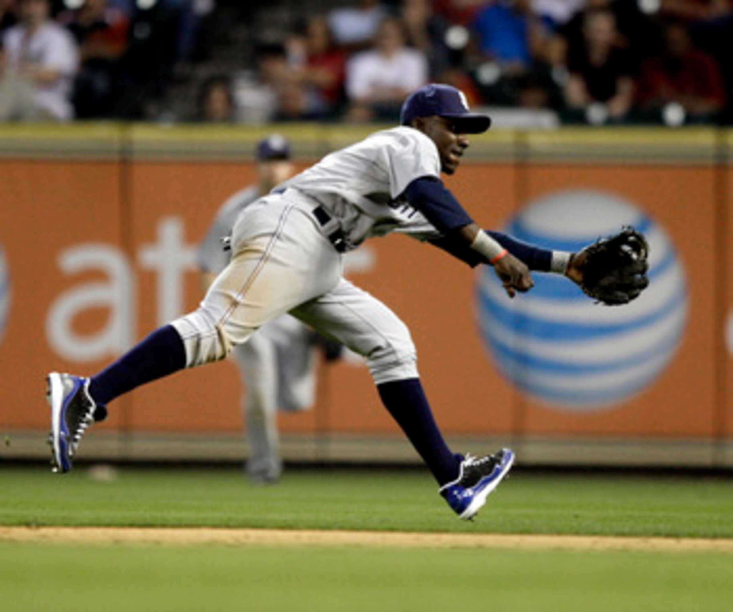 HOUSTON - APRIL 15:  Second baseman Orlando Hudson #1 of the San Diego Padres can't reach this ground ball hit by Carlos Lee #45 of the Houston Astros in the ninth inning at Minute Maid Park on April 15, 2011 in Houston, Texas.  (Photo by Bob Levey/Getty