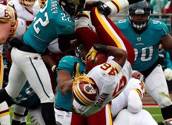 JACKSONVILLE, FL - DECEMBER 26:  Ryan Torain #46 of the Washington Redskins dives for a touchdown over Don Carey #22 of the Jacksonville Jaguars during the game at EverBank Field on December 26, 2010 in Jacksonville, Florida.  (Photo by Sam Greenwood/Gett