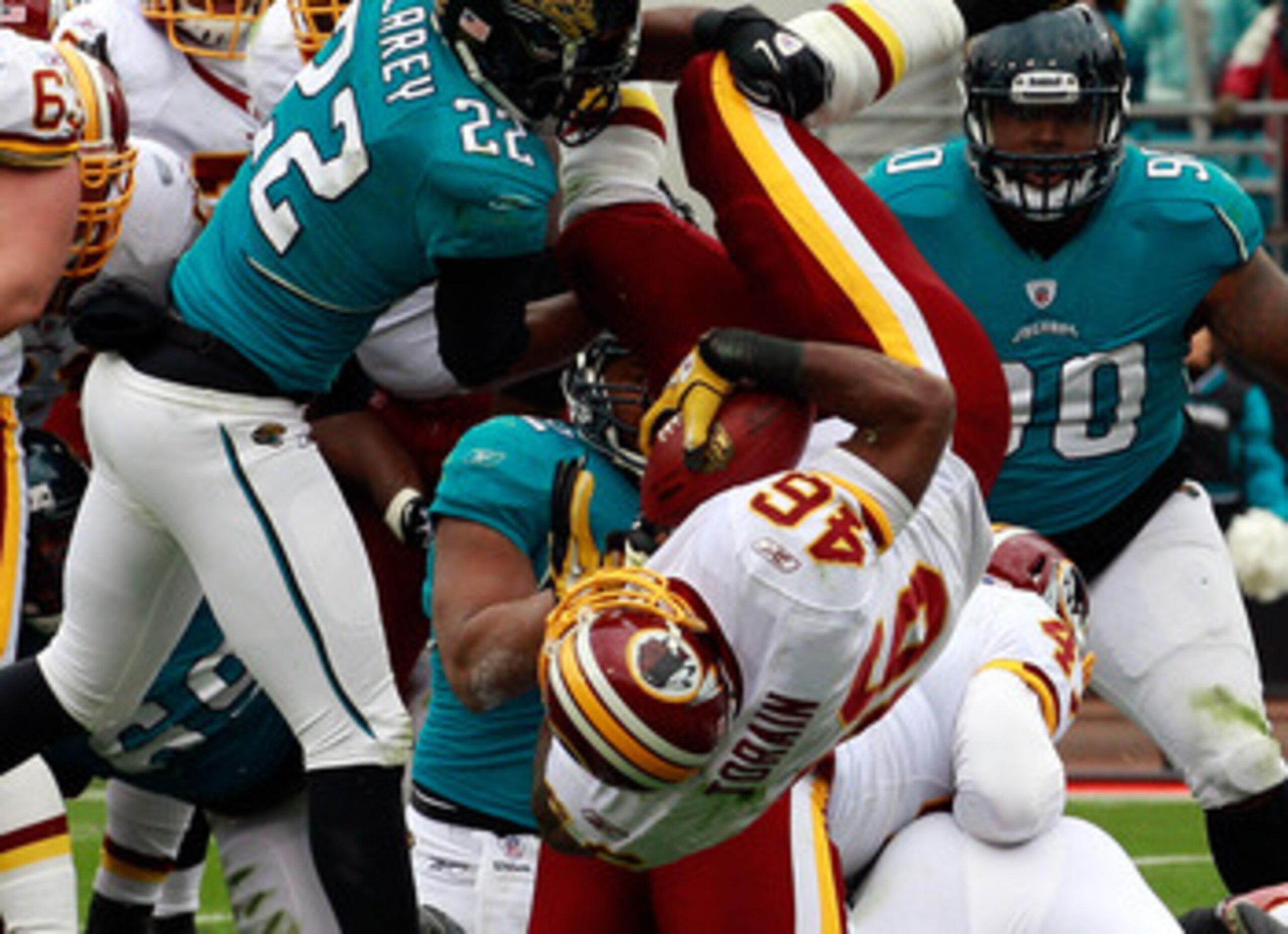 JACKSONVILLE, FL - DECEMBER 26:  Ryan Torain #46 of the Washington Redskins dives for a touchdown over Don Carey #22 of the Jacksonville Jaguars during the game at EverBank Field on December 26, 2010 in Jacksonville, Florida.  (Photo by Sam Greenwood/Gett