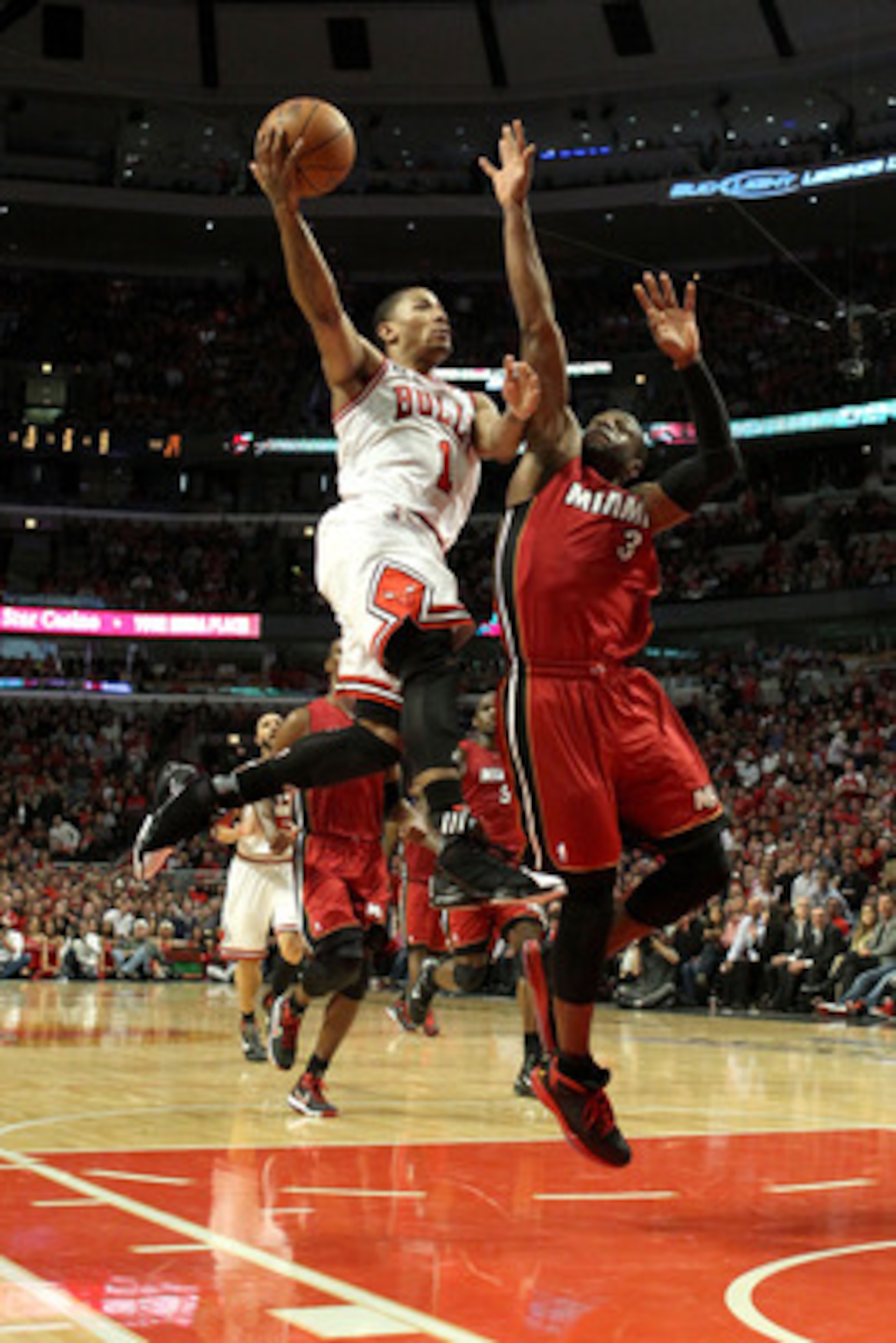 CHICAGO, IL - MAY 26:  Derrick Rose #1 of the Chicago Bulls drives for a shot attempt against Dwyane Wade #3 of the Miami Heat in Game Five of the Eastern Conference Finals during the 2011 NBA Playoffs on May 26, 2011 at the United Center in Chicago, Illi