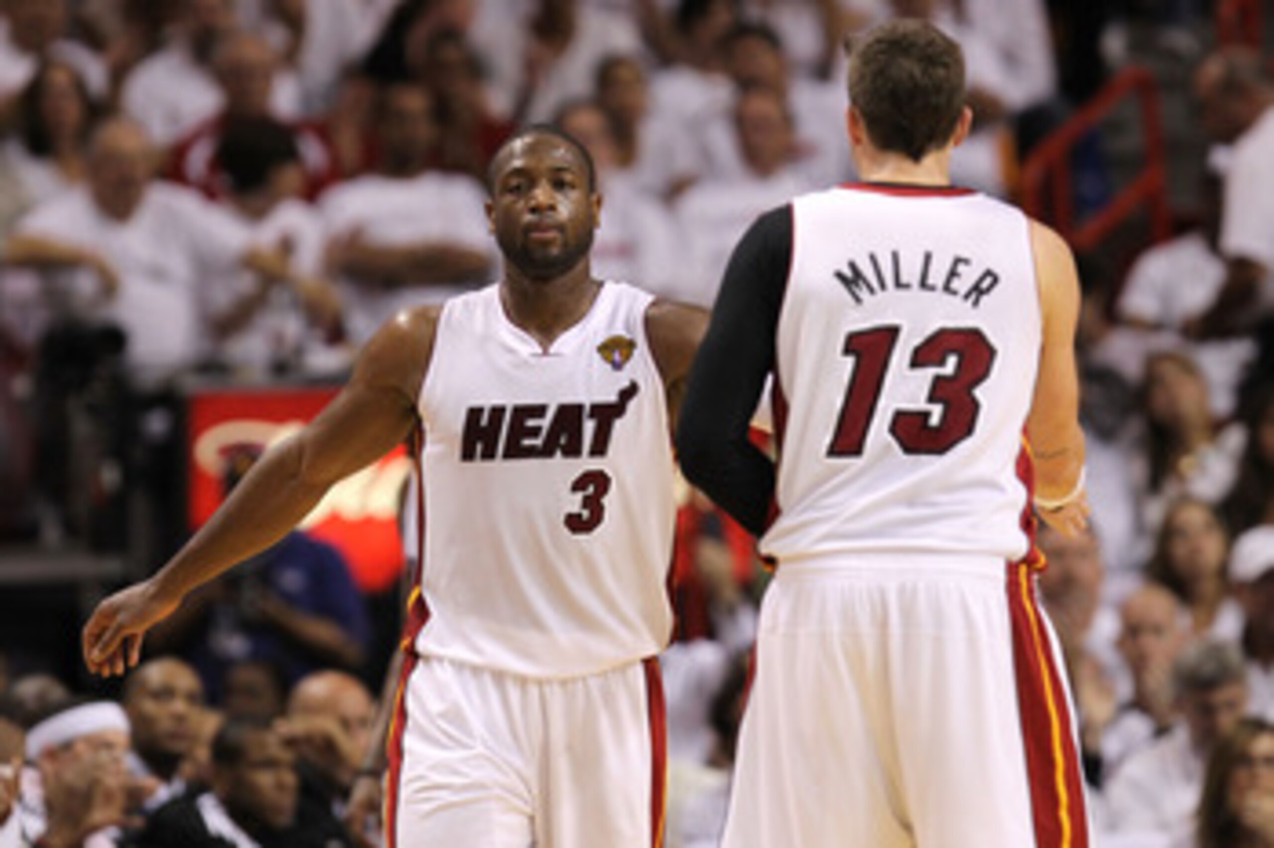 MIAMI, FL - JUNE 02:  Dwyane Wade #3 of the Miami Heat reacts alongside teammate Mike Miller #13 in the second quarter against the Dallas Mavericks in Game Two of the 2011 NBA Finals at American Airlines Arena on June 2, 2011 in Miami, Florida. NOTE TO US