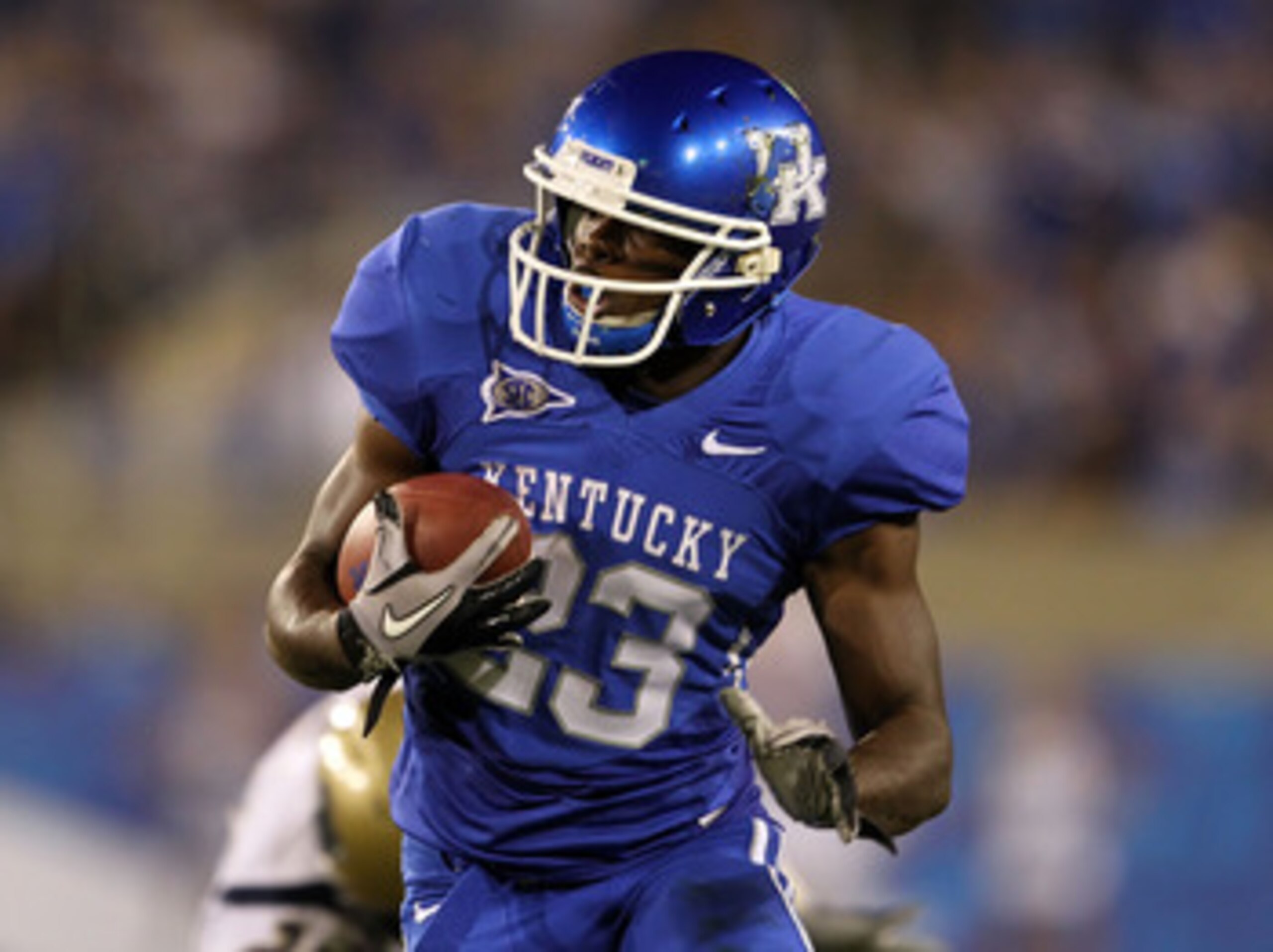 LEXINGTON, KY - SEPTEMBER 18:  Donald Russell #23 of the Kentucky Wildcats runs with the ball during the game against the Akron Zips at Commonwealth Stadium on September 18, 2010 in Lexington, Kentucky.  (Photo by Andy Lyons/Getty Images)