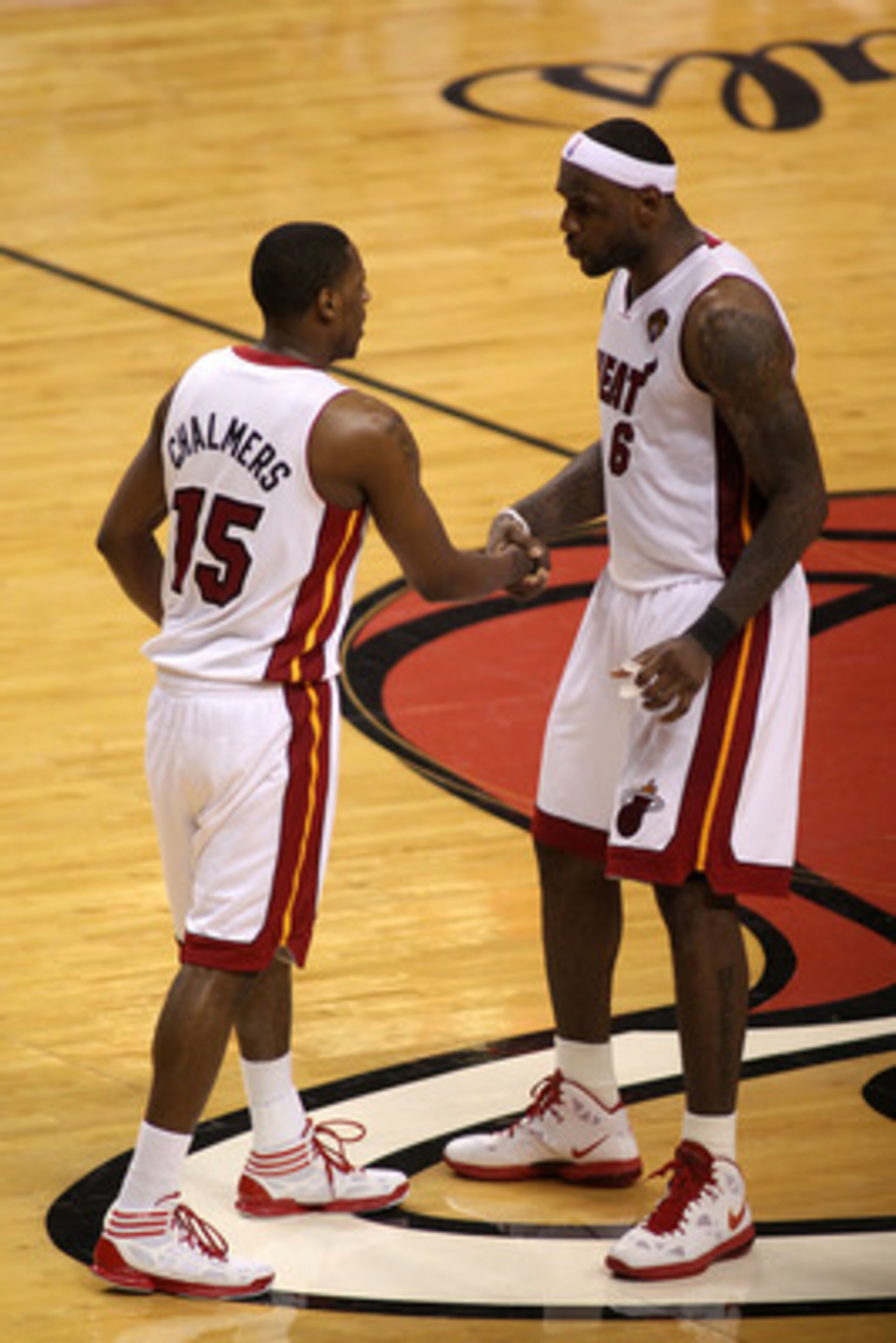 MIAMI, FL - JUNE 02:   LeBron James #6 (R) of the Miami Heat talks with Mario Chalmers #15 against the Dallas Mavericks in Game Two of the 2011 NBA Finals at American Airlines Arena on June 2, 2011 in Miami, Florida. NOTE TO USER: User expressly acknowled