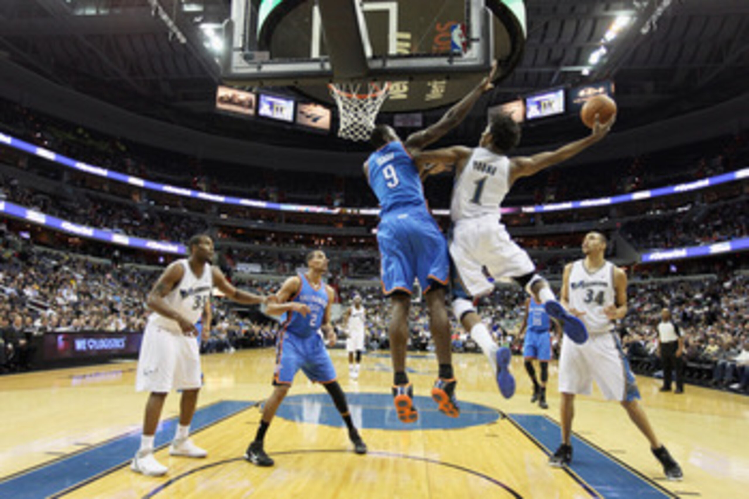 WASHINGTON, DC - MARCH 14: Serge Ibaka #9 of the Oklahoma City Thunder defends against Nick Young #1 of the Washington Wizards during the first half at the Verizon Center on March 14, 2011 in Washington, DC. NOTE TO USER: User expressly acknowledges and a WASHINGTON, DC - MARCH 14: Serge Ibaka #9 of the Oklahoma City Thunder defends against Nick Young #1 of the Washington Wizards during the first half at the Verizon Center on March 14, 2011 in Washington, DC. NOTE TO USER: User expressly acknowledges and a