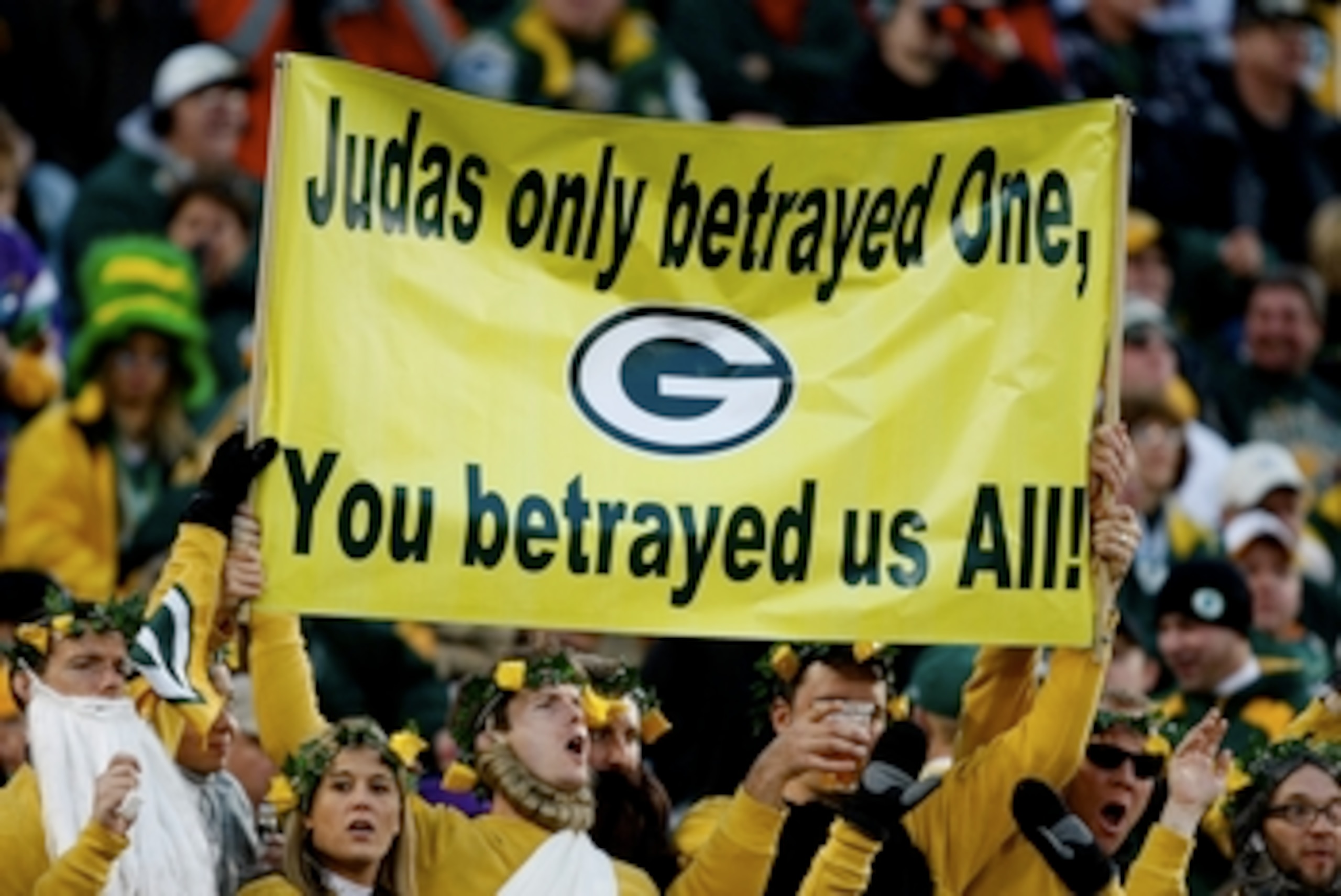 GREEN BAY, WI - NOVEMBER 01:  Fans hold a sign referring to quarterback Brett Favre #4 of the Minnesota Vikings during the game against the Green Bay Packers at Lambeau Field on November 1, 2009 in Green Bay, Wisconsin. (Photo by Scott Boehm/Getty Images)