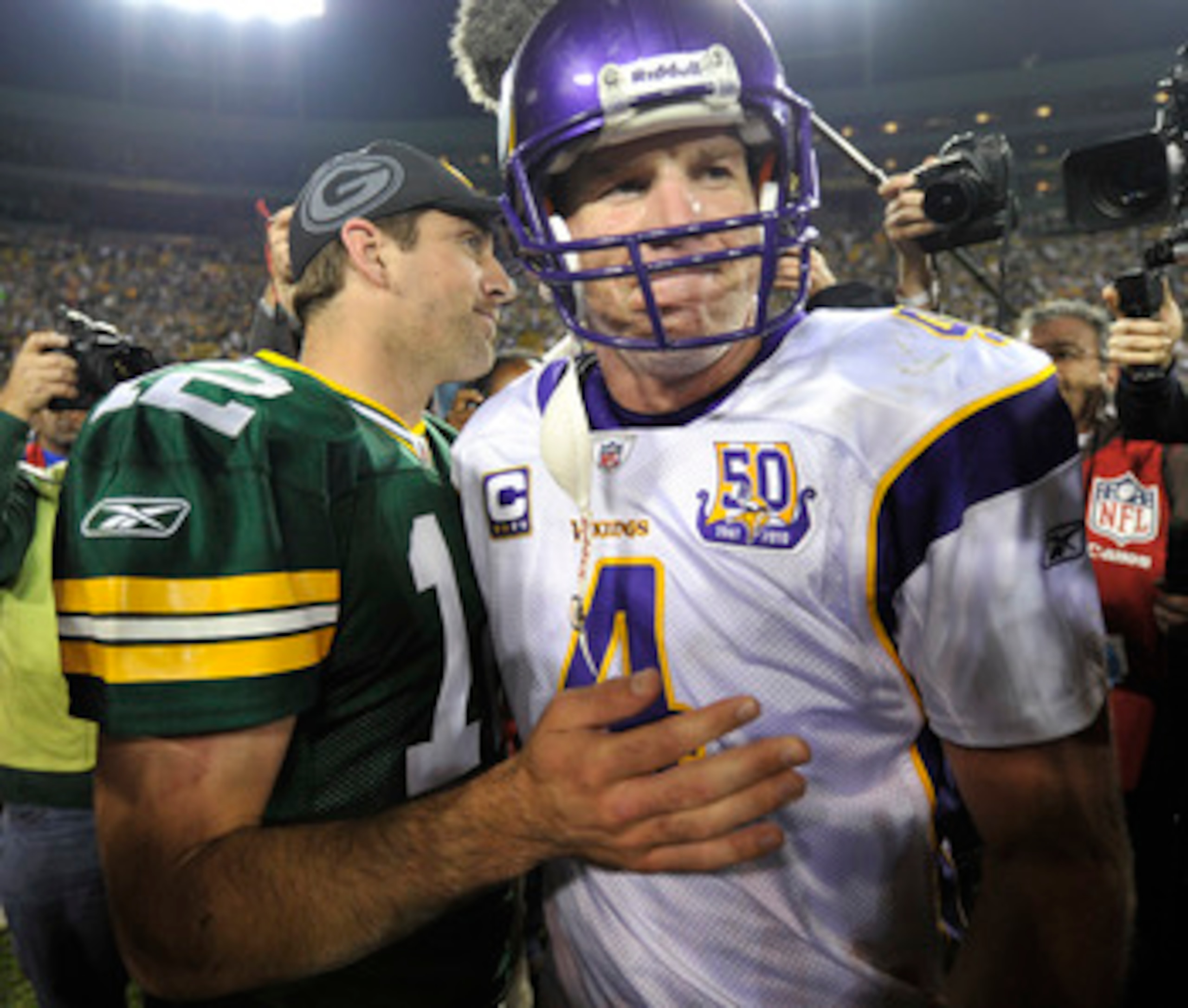 GREEN BAY, WI - OCTOBER 24: Aaron Rodgers #12 of the Green Bay Packers meets with Brett Favre #4 of the Minnesota Vikings after the Packers defeated the Vikings 28-24 at Lambeau Field on October 24, 2010 in Green Bay, Wisconsin. (Photo by Jim Prisching/Ge