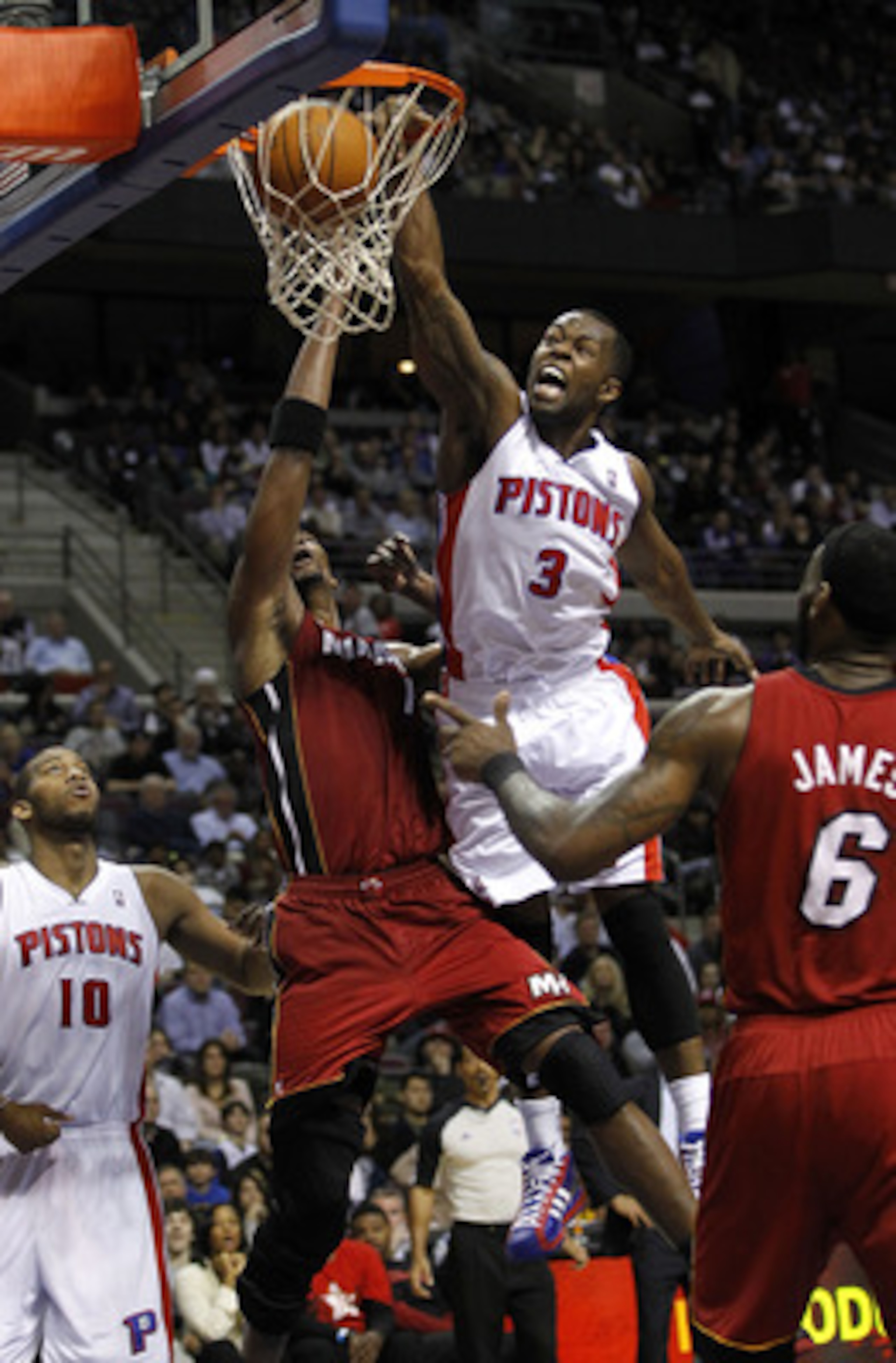 AUBURN HILLS, MI - MARCH 23: Rodney Stuckey #3 Detroit Pistons gets in for a dunk between Chris Bosh #1 and LeBron James #6 of the Miami Heat at The Palace of Auburn Hills on March 23, 2011 in Auburn Hills, Michigan. Miami won the game 100-94. NOTE TO US AUBURN HILLS, MI - MARCH 23: Rodney Stuckey #3 Detroit Pistons gets in for a dunk between Chris Bosh #1 and LeBron James #6 of the Miami Heat at The Palace of Auburn Hills on March 23, 2011 in Auburn Hills, Michigan. Miami won the game 100-94. NOTE TO US