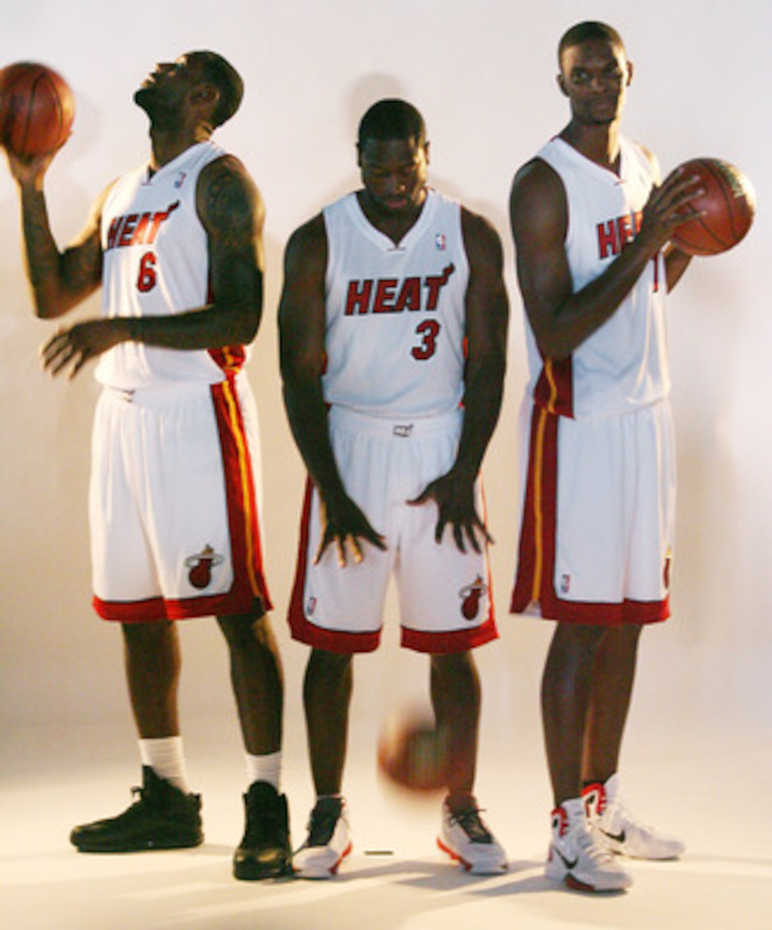 MIAMI - SEPTEMBER 27:  (L-R) LeBron James, Dwyane Wade and Chris Bosh of the Miami Heat pose for photos during media day at the Bank United Center on September 27, 2010 in Miami, Florida.  (Photo by Marc Serota/Getty Images)