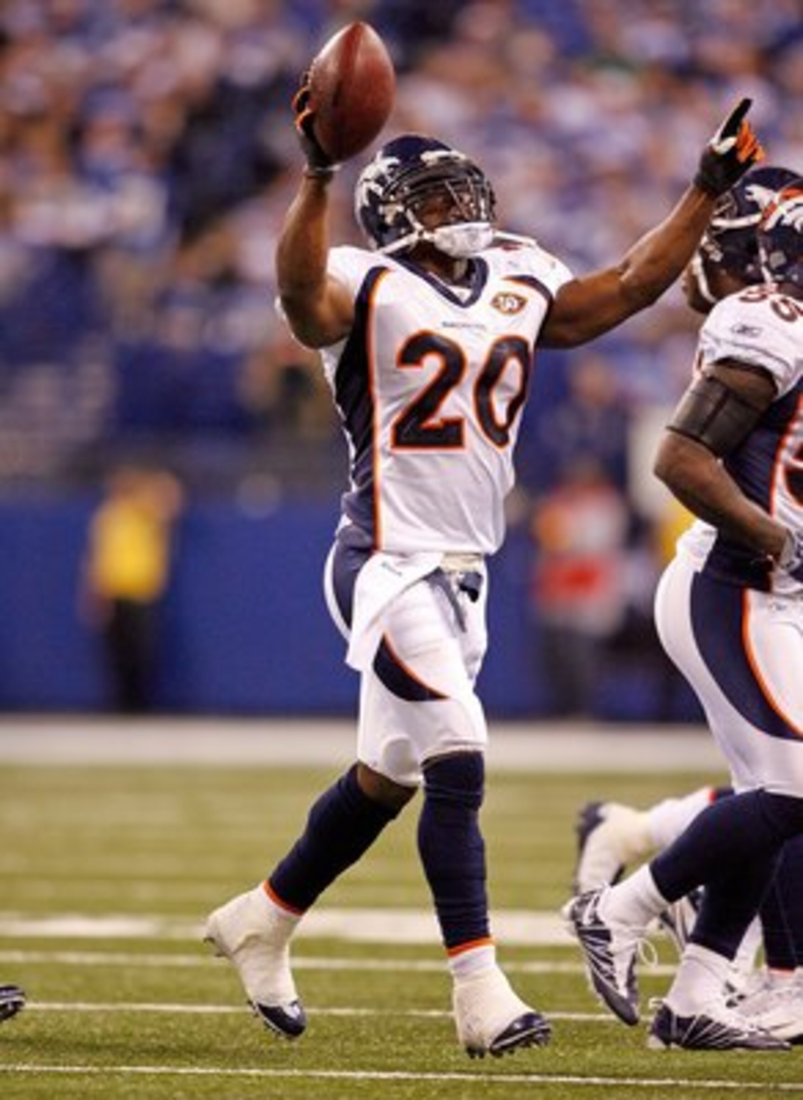 INDIANAPOLIS - DECEMBER 13:  Brian Dawkins #20 of the Denver Broncos celebrates after intercepting a pass during the NFL game against the Indianapolis Colts at Lucas Oil Stadium on December 13, 2009 in Indianapolis, Indiana.  The Colts won 28-16.  (Photo