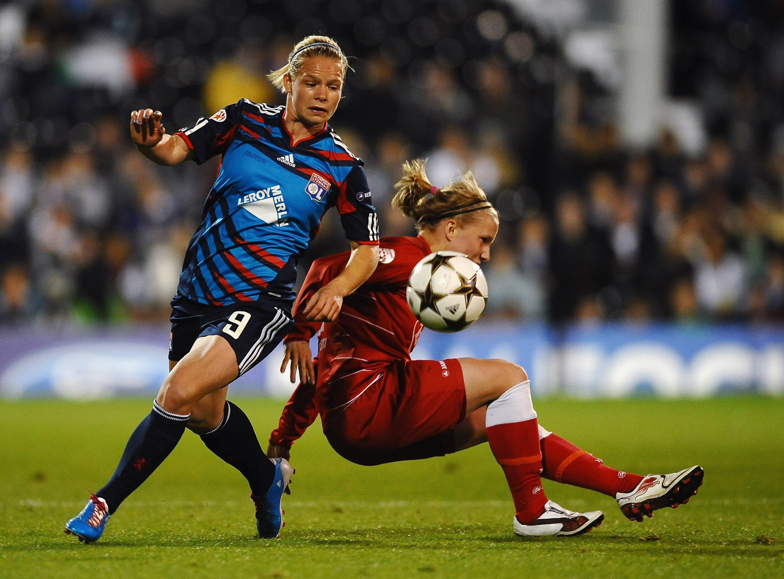 LONDON, ENGLAND - MAY 26:  Eugenie Le Sommer of Lyon battles with Tabea Kemme of Turbine Potsdam during the UEFA Women's Champions League Final between Lyon and Turbine Potsdam at Craven Cottage on May 26, 2011 in London, England.  (Photo by Laurence Grif