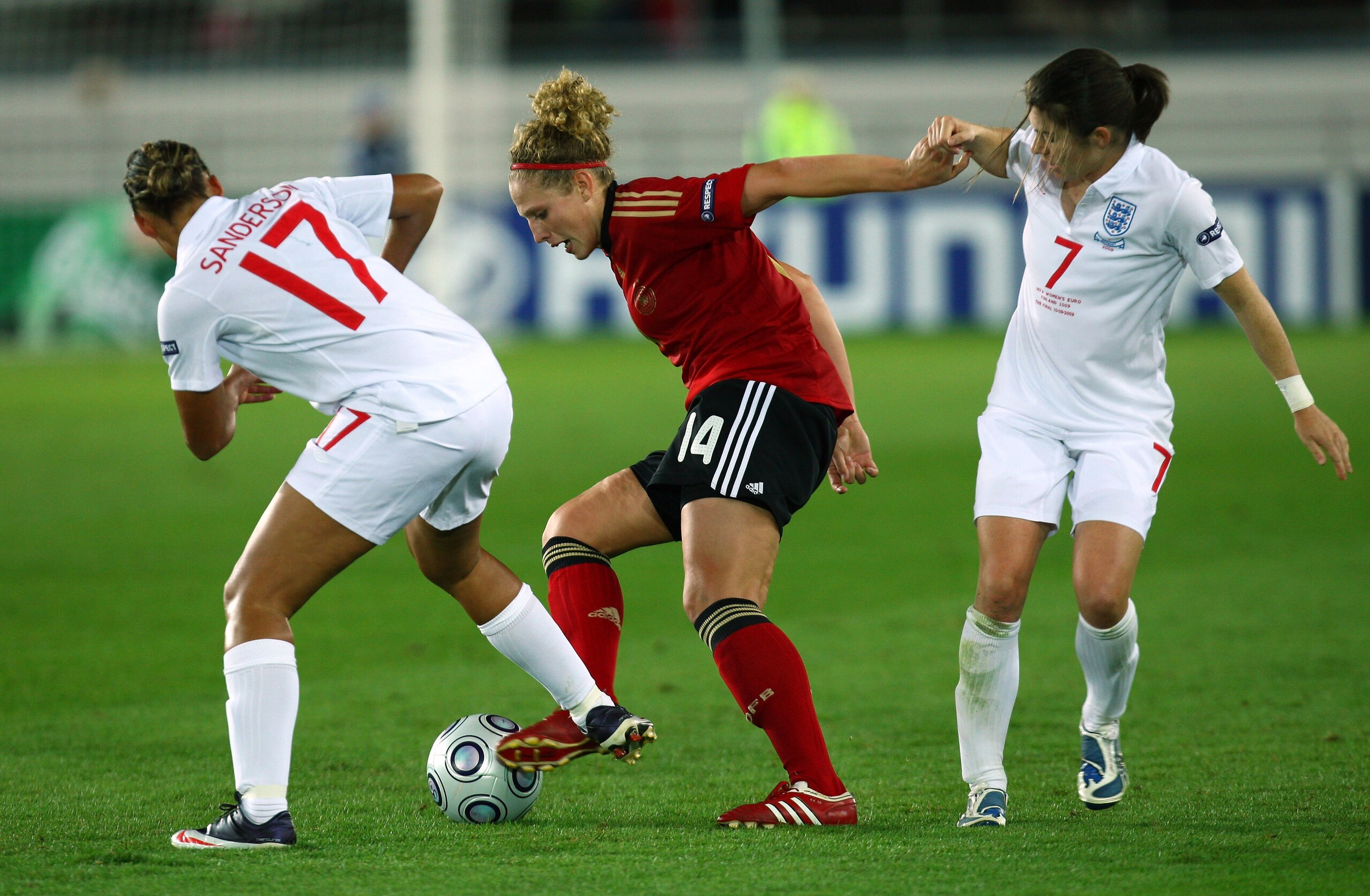 HELSINKI, FINLAND - SEPTEMBER 10:  Karen Carney (R) of England tries to tackle Kim Kulig of Germany during the UEFA Women's Euro 2009 Final match between England and Germany at the Helsinki Olympic Stadium on September 10, 2009 in Helsinki, Finland.  (Pho