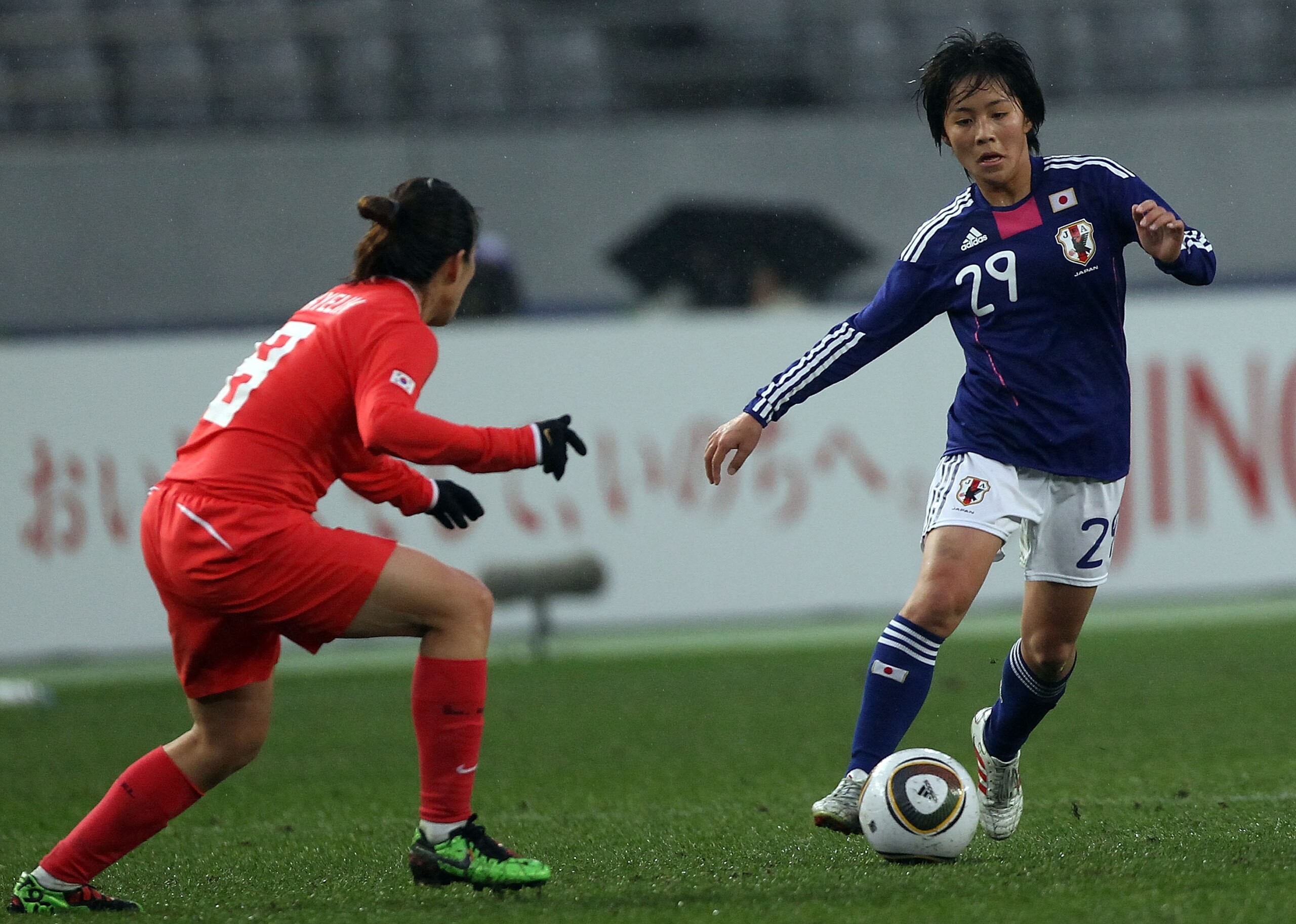 TOKYO - FEBRUARY 13:  Mana Iwabuchi of Japan and Kye Lim Lee of South Korea compete for the ball during the East Asian Football Federation (EAFF) Women's Championship 2010 match between Japan and South Korea at Ajinomoto Stadium on February 13, 2010 in To