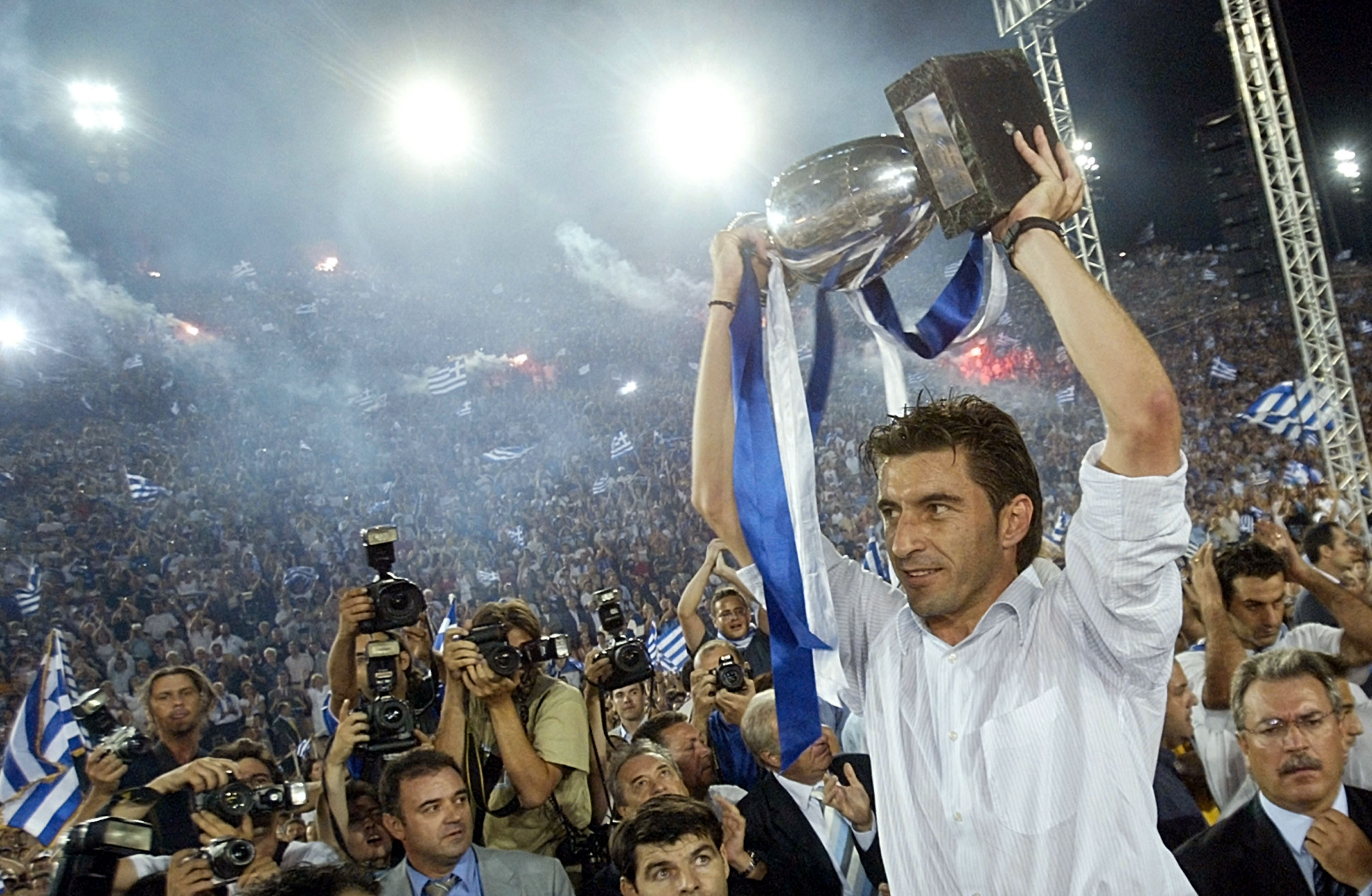 ATHENS, GREECE - JULY 5:  Greek national team captain Theodoros Zagorakis raises the trophy during a victory fiesta on July 5, 2004 at Panathenaic Stadium in Athens, Greece. Thousands of Greeks welcomed the new UEFA Euro 2004 Champions upon their arrival