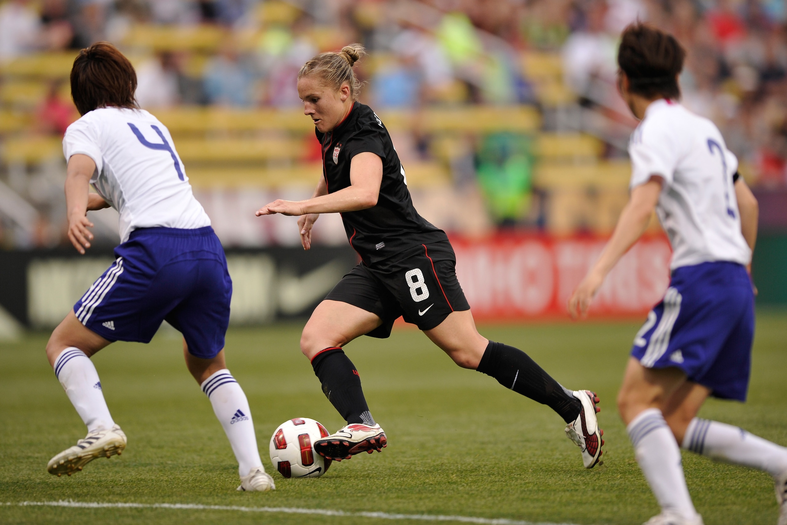 COLUMBUS, OH - MAY 14:  Amy Rodriguez #8 of the United States controls the ball between two Japan defenders on May 14, 2011 at Crew Stadium in Columbus, Ohio.  (Photo by Jamie Sabau/Getty Images)