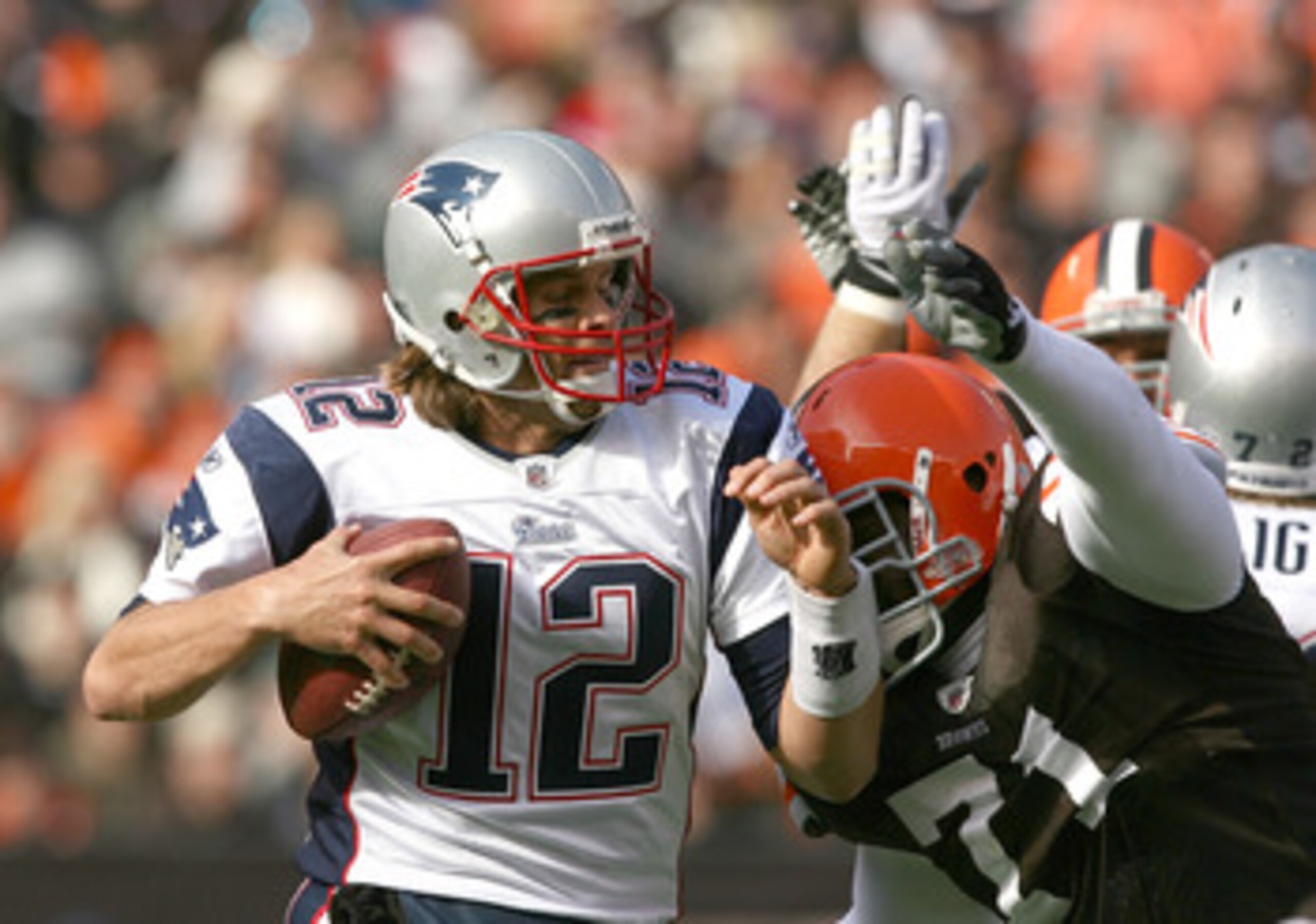 CLEVELAND - NOVEMBER 07:  Quarterback Tom Brady #12 of the New England Patriots is sacked by defensive lineman Ahtyba Rubin #71 of the Cleveland Browns at Cleveland Browns Stadium on November 7, 2010 in Cleveland, Ohio.  (Photo by Matt Sullivan/Getty Imag
