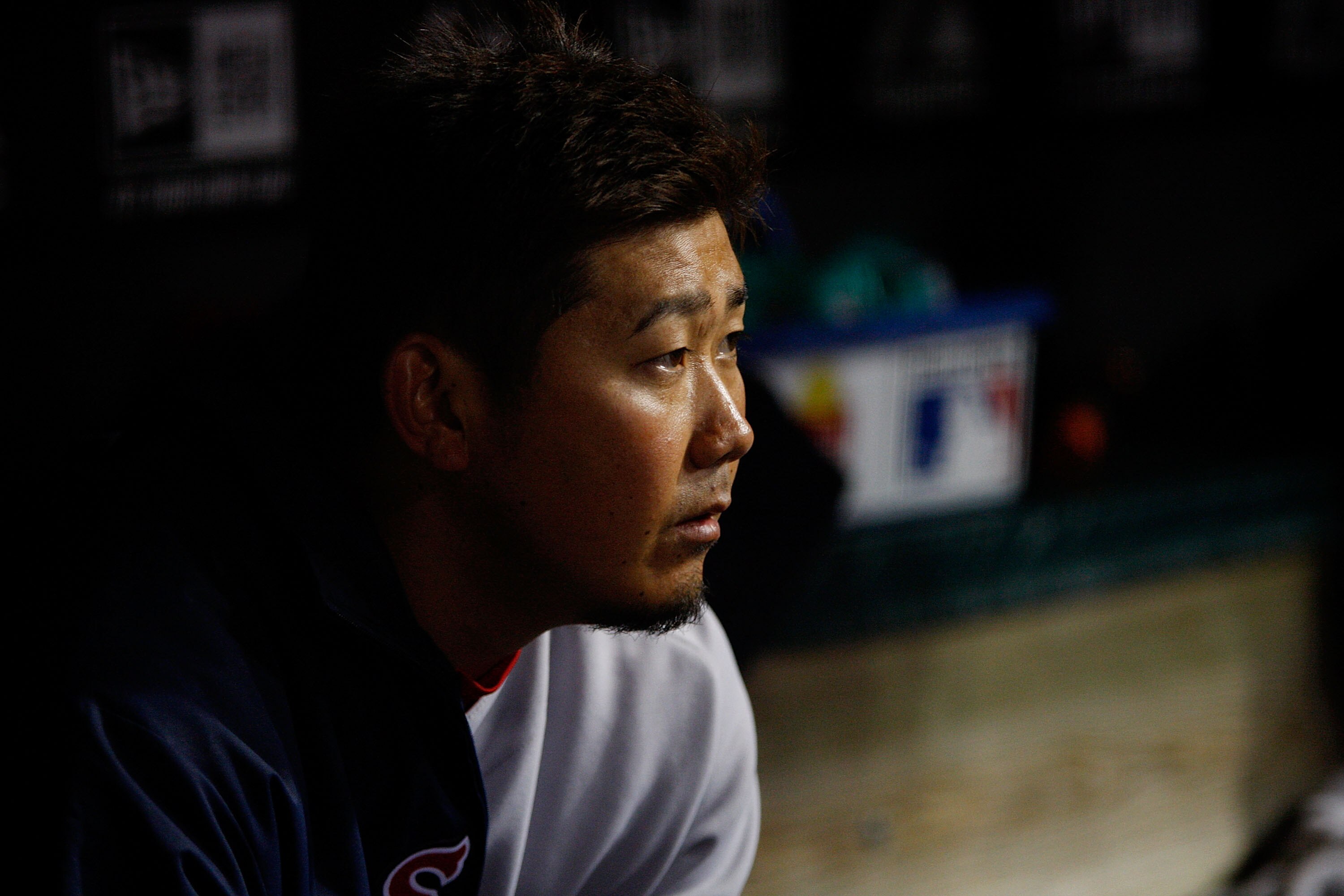 CLEVELAND - APRIL 06:  Daisuke Matsuzaka #18 of the Boston Red Sox sits in the dugout during the game against the Cleveland Indians on April 6, 2011 at Progressive Field in Cleveland, Ohio.  (Photo by Jared Wickerham/Getty Images)