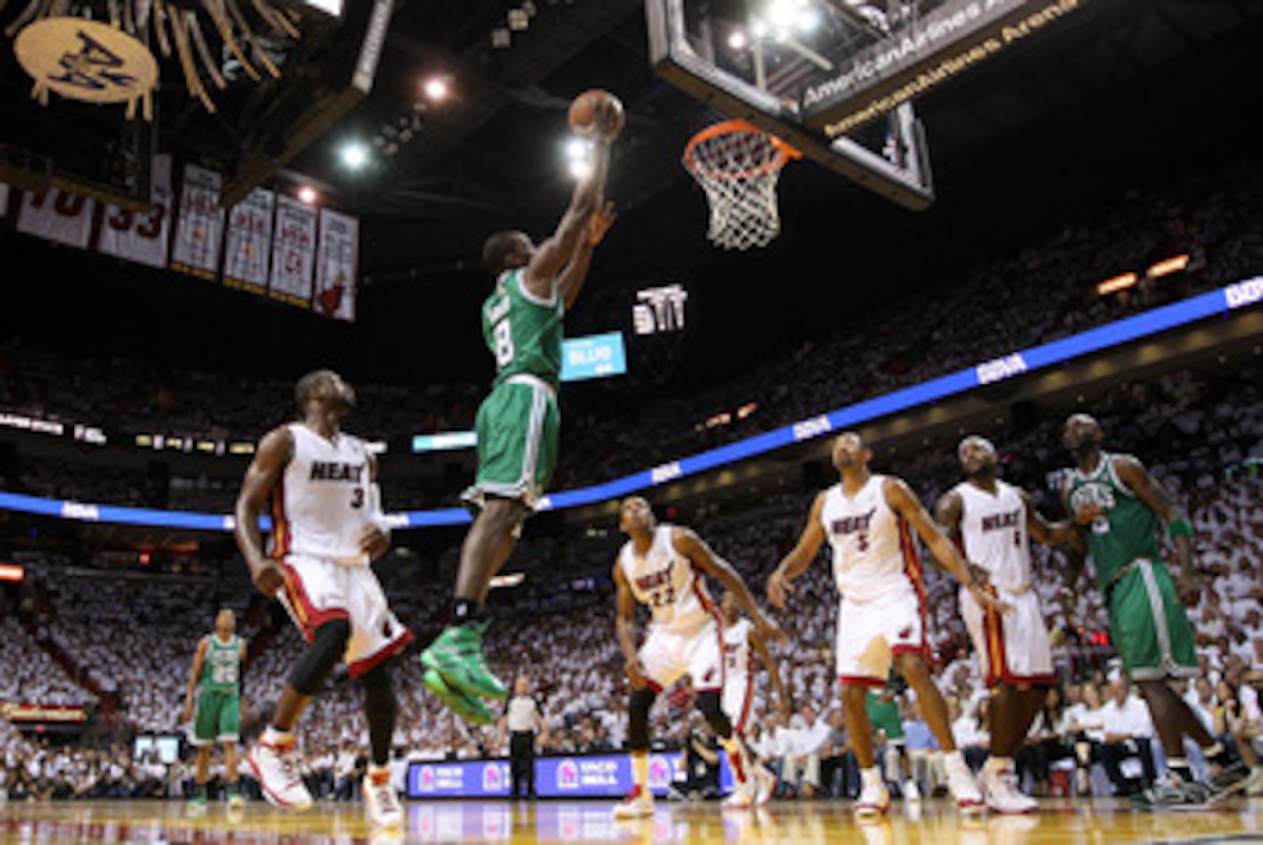 MIAMI, FL - MAY 11: Jeff Green #8 of the Boston Celtics dunks over Juwan Howard #5 and Dwyane Wade #3 of the Miami Heat during Game Five of the Eastern Conference Semifinals of the 2011 NBA Playoffs at American Airlines Arena on May 11, 2011 in Miami, Fl MIAMI, FL - MAY 11: Jeff Green #8 of the Boston Celtics dunks over Juwan Howard #5 and Dwyane Wade #3 of the Miami Heat during Game Five of the Eastern Conference Semifinals of the 2011 NBA Playoffs at American Airlines Arena on May 11, 2011 in Miami, Fl