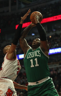 CHICAGO, IL - APRIL 07: Taj Gibson #22 of the Chicago Bulls moves to block a shot by Glen Davis #11 of the Boston Celtics at United Center on April 7, 2011 in Chicago, Illinois. The Bulls defeated the Celtics 97-81. NOTE TO USER: User expressly acknowledg