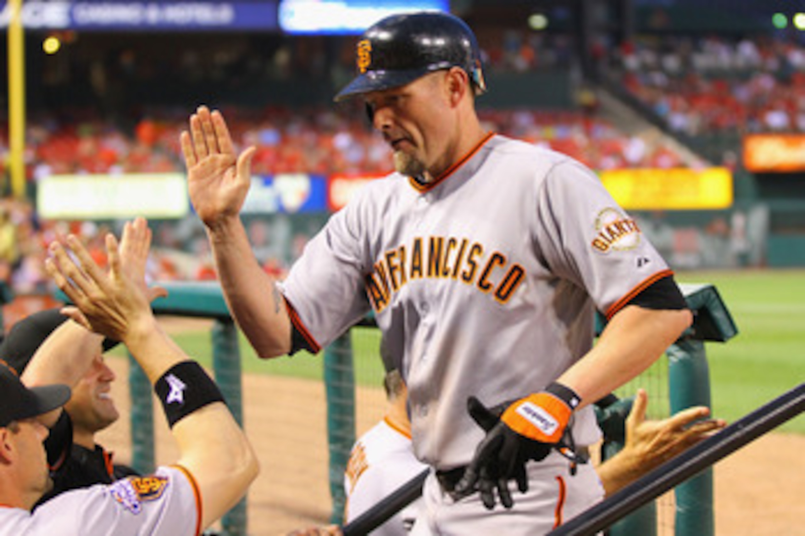 ST. LOUIS, MO - JUNE 2: Aubrey Huff #17 of the San Francisco Giants is congratulated by teammates after hitting a two-run home run against the St. Louis Cardinals at Busch Stadium on June 2, 2011 in St. Louis, Missouri.  (Photo by Dilip Vishwanat/Getty Im